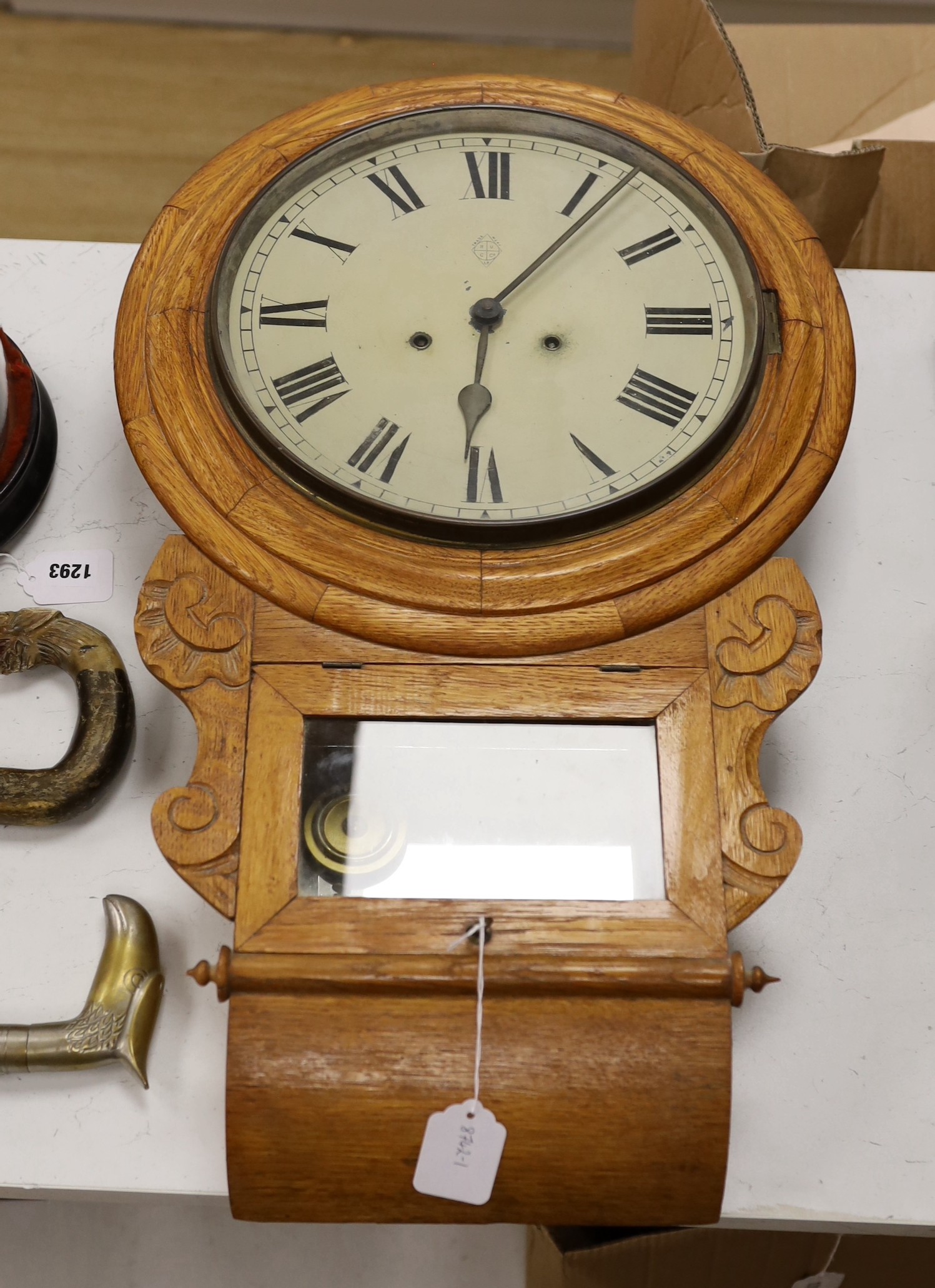 An oak cased drop dial wall clock, with key and pendulum                                                                                                                                                                    