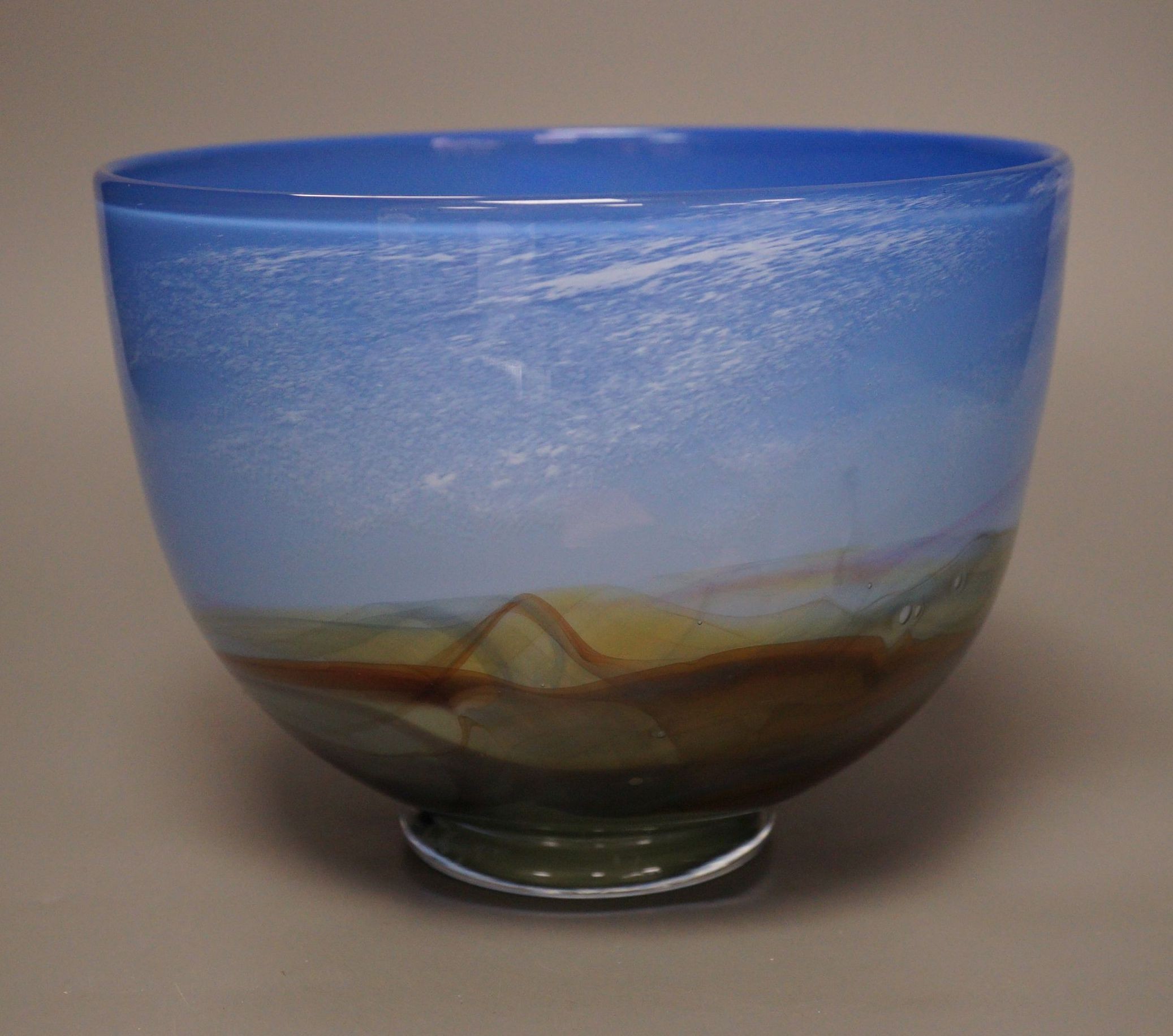 An Art Glass bowl depicting a landscape of the Scottish Highlands, 1984, 15.5cm tall                                                                                                                                        