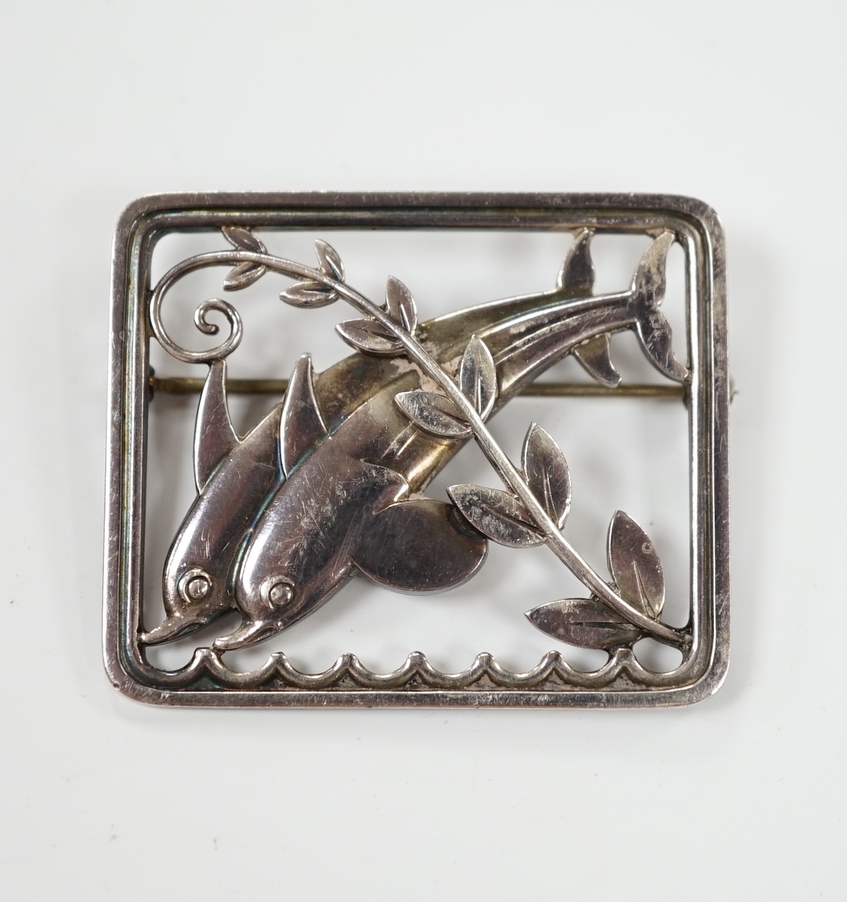 A Georg Jensen silver twin dolphin brooch, design no. 251, 38mm.                                                                                                                                                            