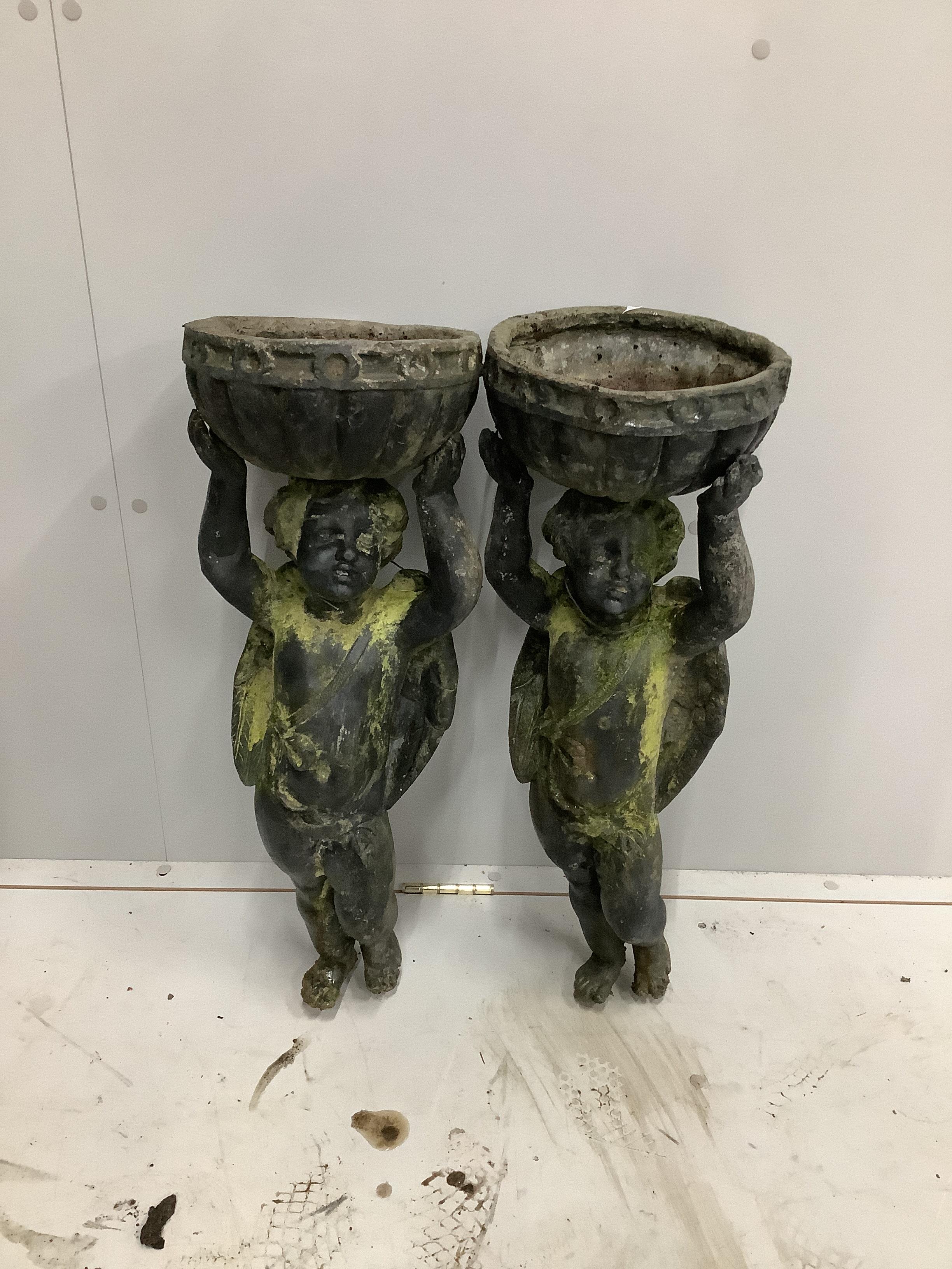 A pair of Victorian lead angel garden urns, lacking bases, height 73cm                                                                                                                                                      