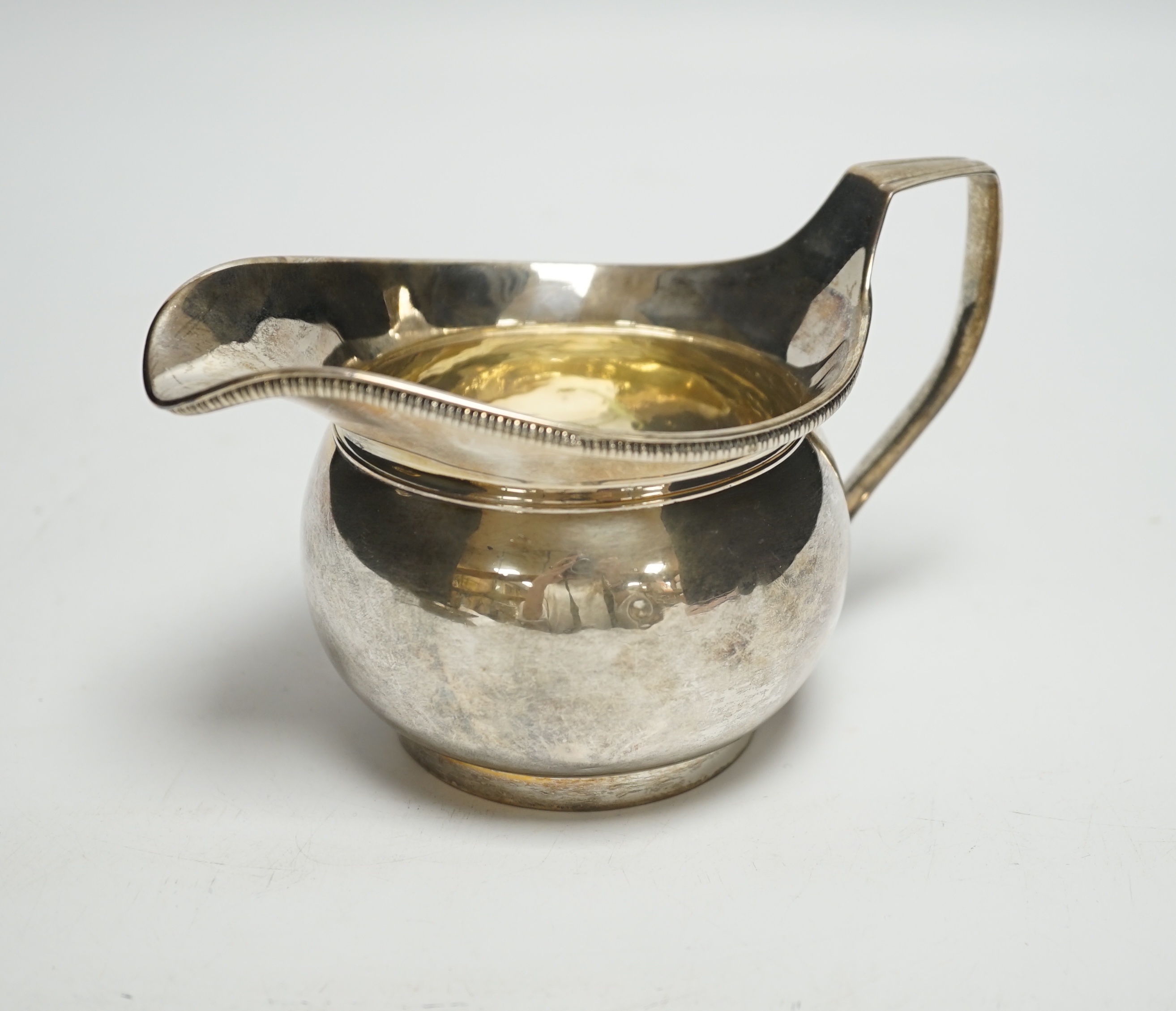 A George III silver cream jug, Richard Cook, London, 1802, 6.3oz.                                                                                                                                                           