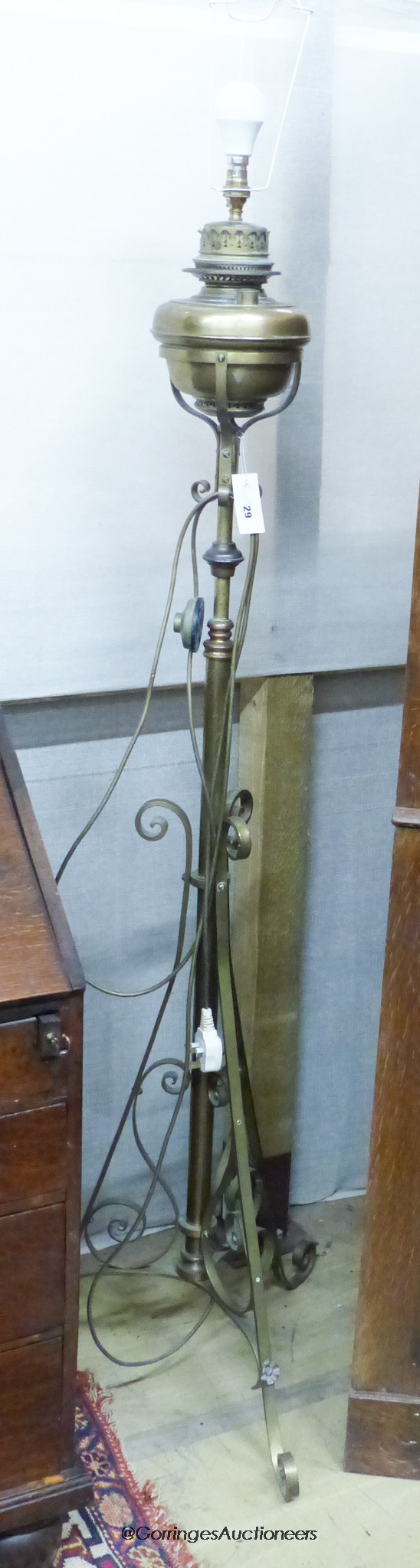 An Edwardian brass telescopic oil lamp standard converted to electricity                                                                                                                                                    