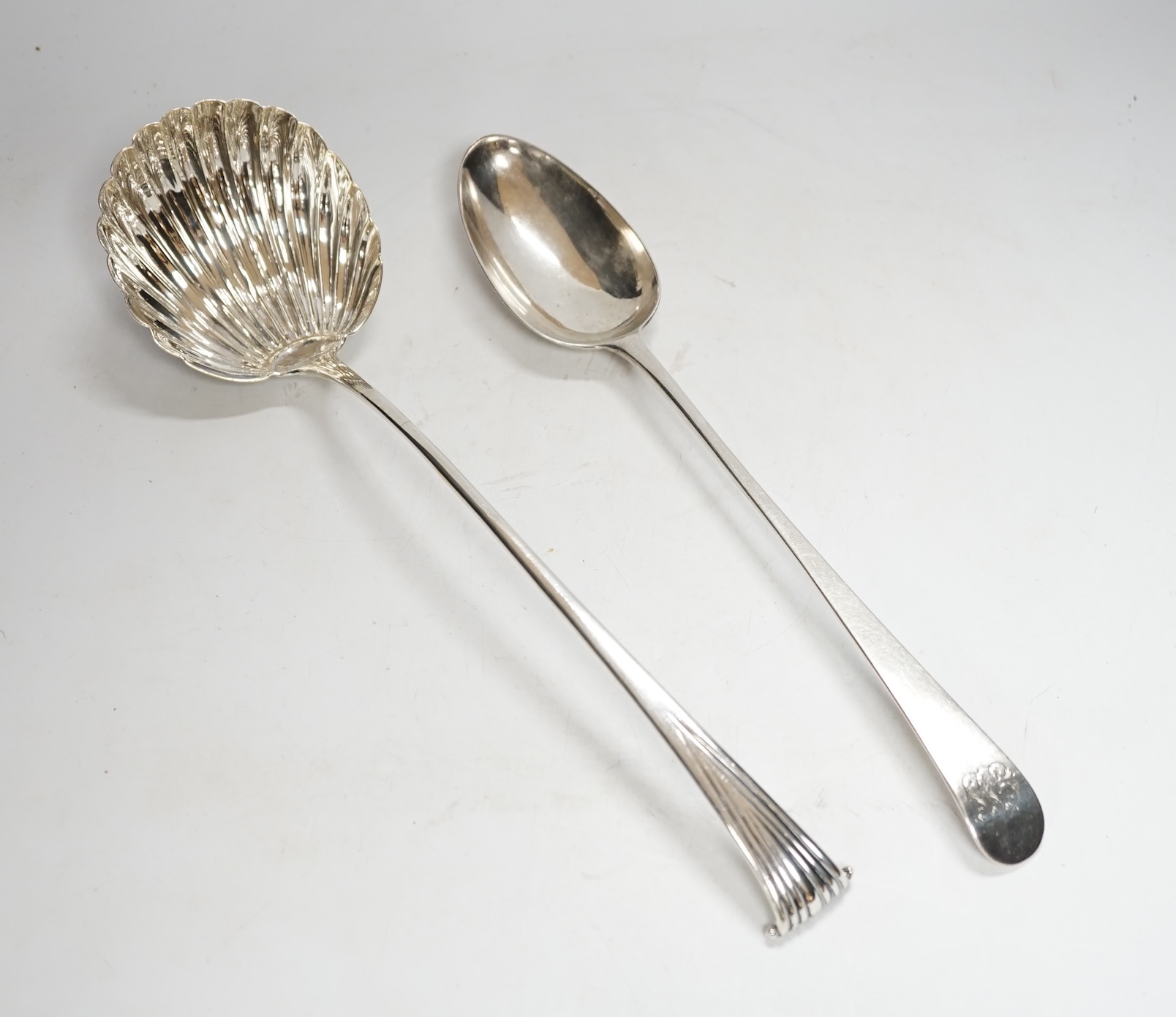 A George III silver Old English pattern basting spoon, Thomas Evans, London, 1785, 31.4cm, together with a white metal Onslow pattern soup ladle.                                                                           