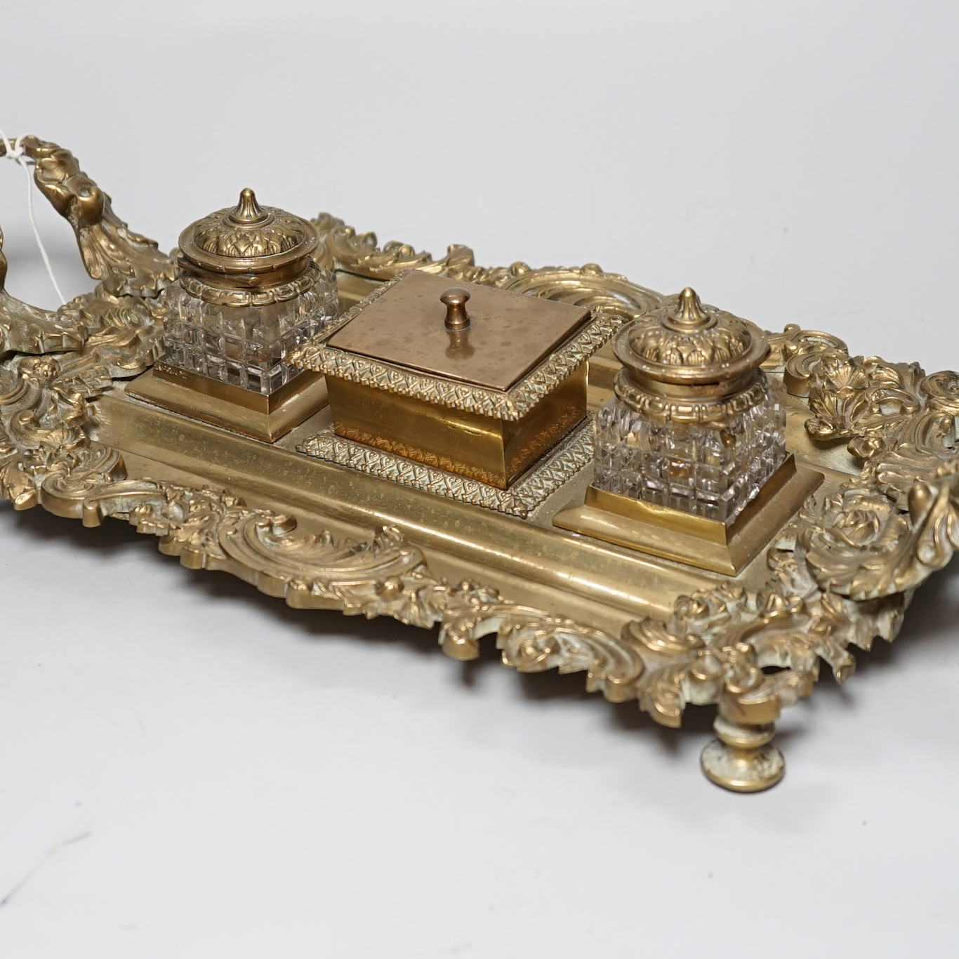 An early 20th century French cast brass desk stand, 45cm long                                                                                                                                                               