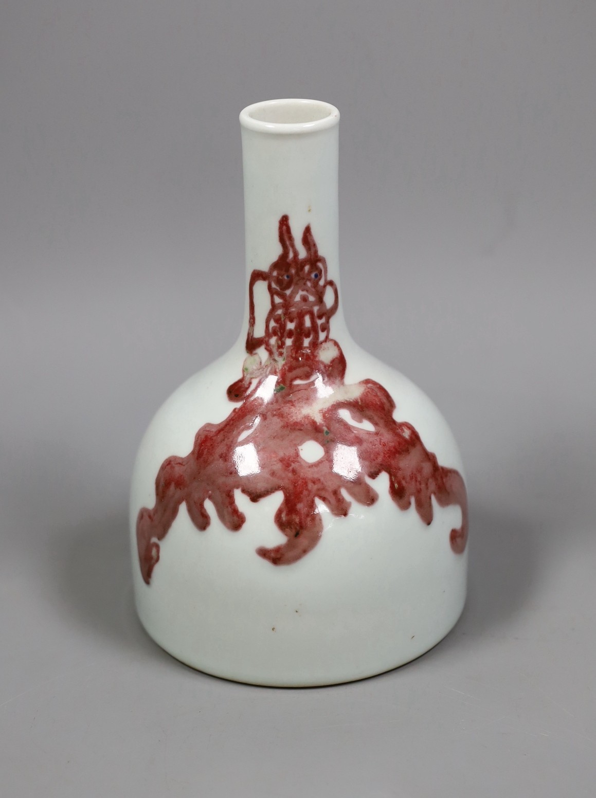 A Chinese underglaze copper red ’dragon’ bottle vase, 18cm tall                                                                                                                                                             