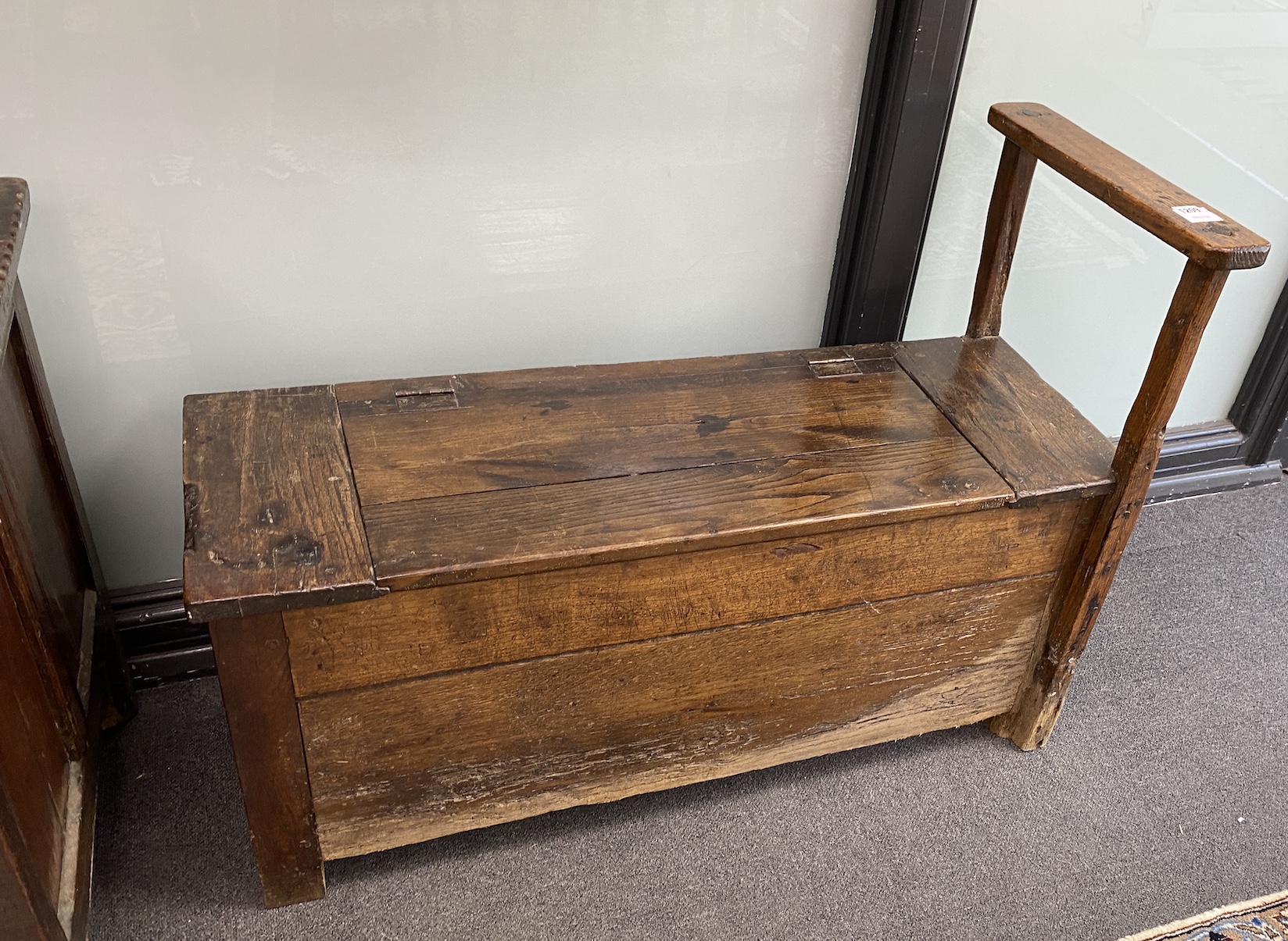 A French provincial oak hall chest, with a single side arm rail, width 98cm, depth 36cm, height 72cm                                                                                                                        