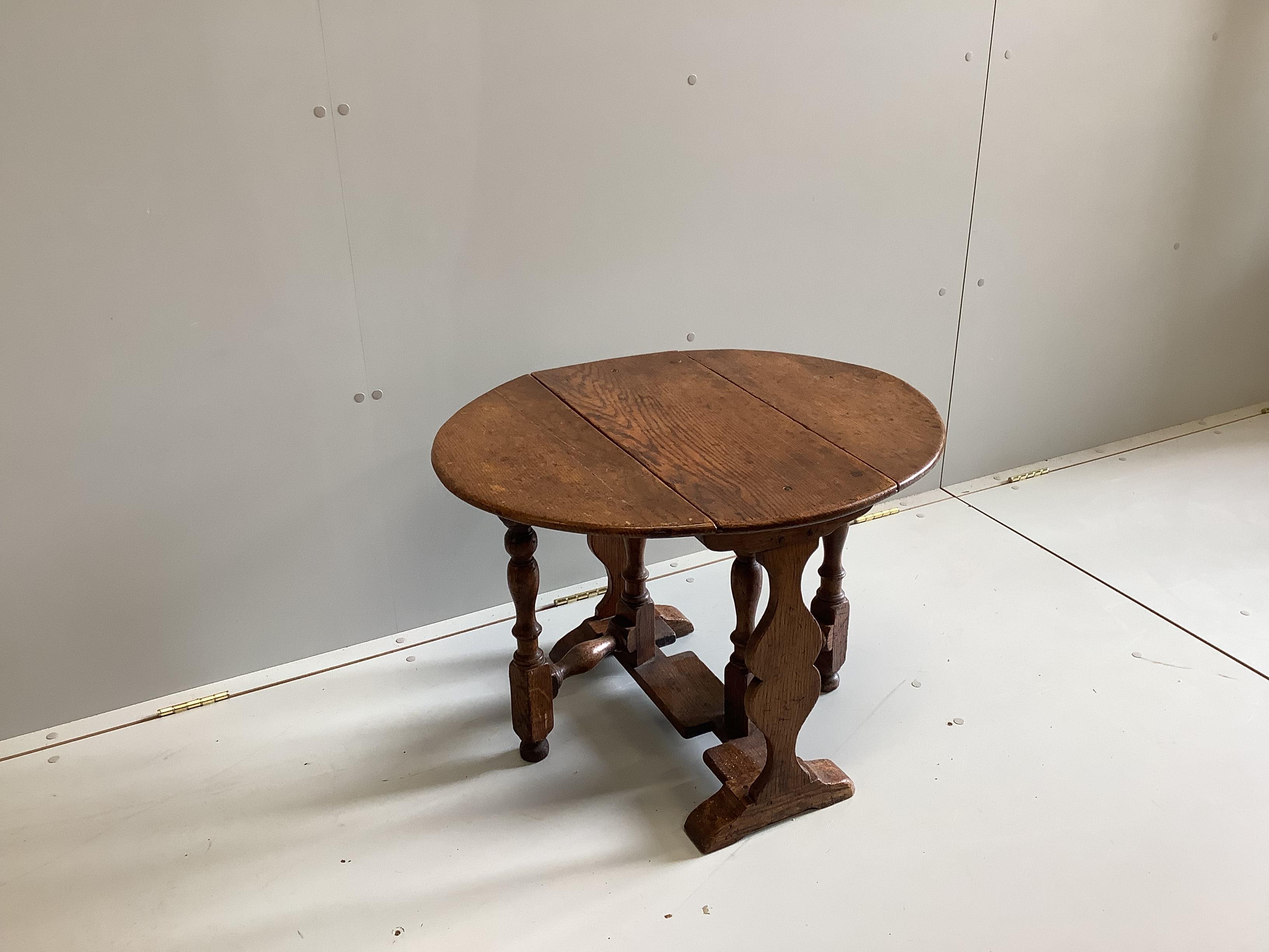 An 18th century style oak drop flap occasional table, width 60cm, depth 29cm, height 50cm                                                                                                                                   