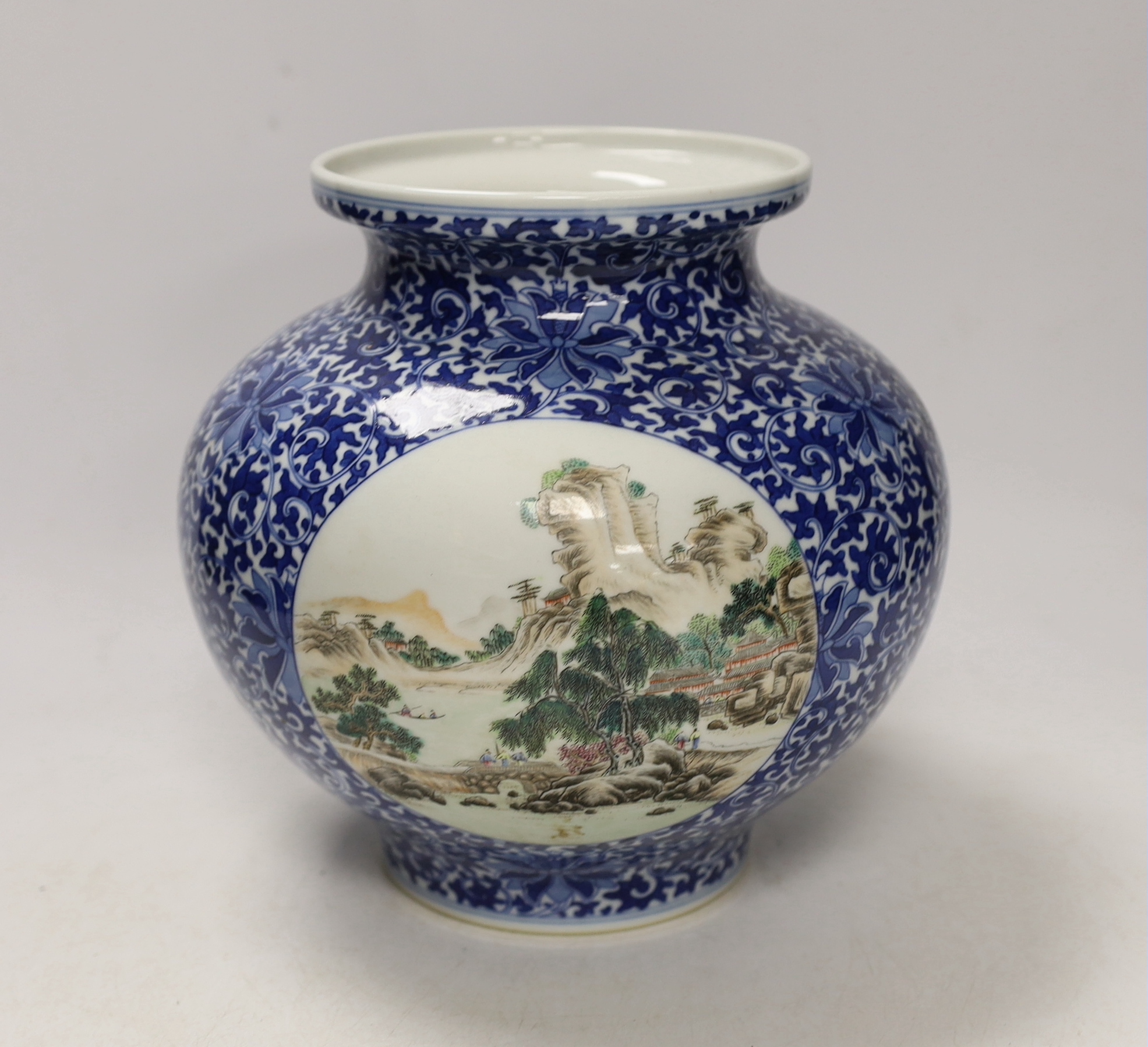 A Chinese enamelled blue and white jar, Qianlong mark, 22cm high                                                                                                                                                            