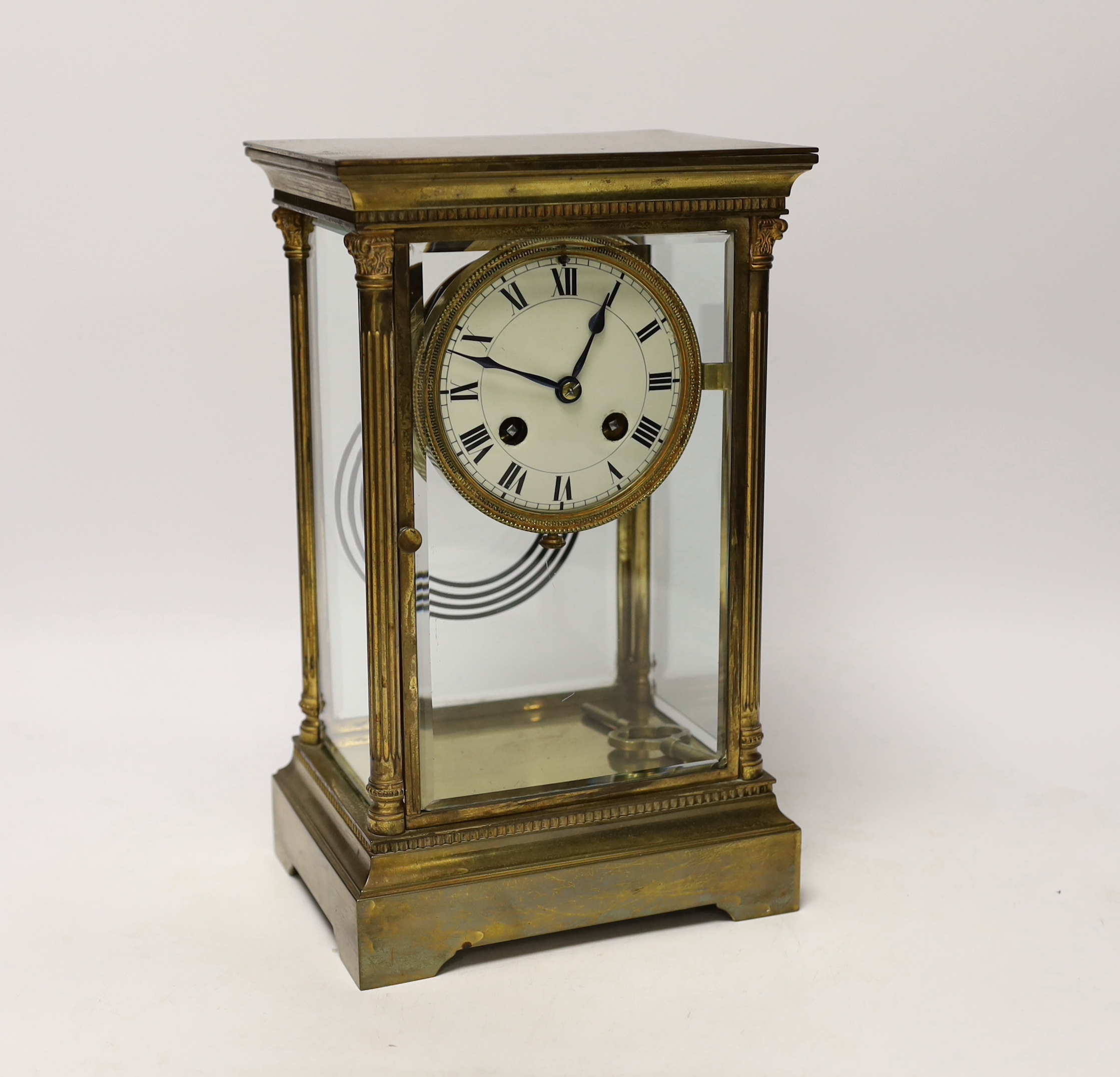 A 19th century French four glass clock, striking on a gong with mercury pendulum, 16.5cm wide x 28cm high                                                                                                                   