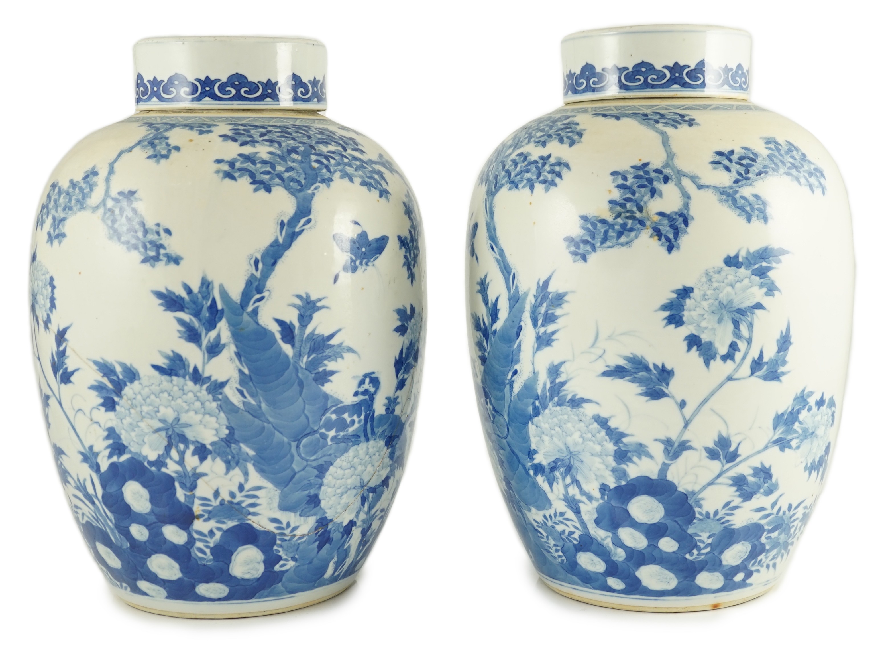 A pair of large Chinese blue and white ovoid jars and associated covers, 19th century, 34.5cm high, damage and repairs                                                                                                      