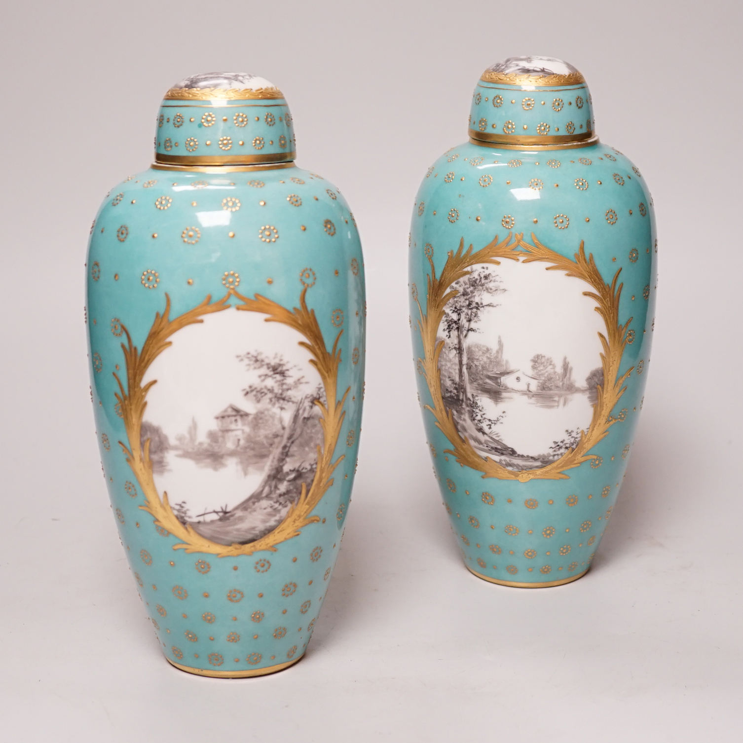 A pair of late 19th century Sevres style turquoise ground vases and covers, 24cm                                                                                                                                            