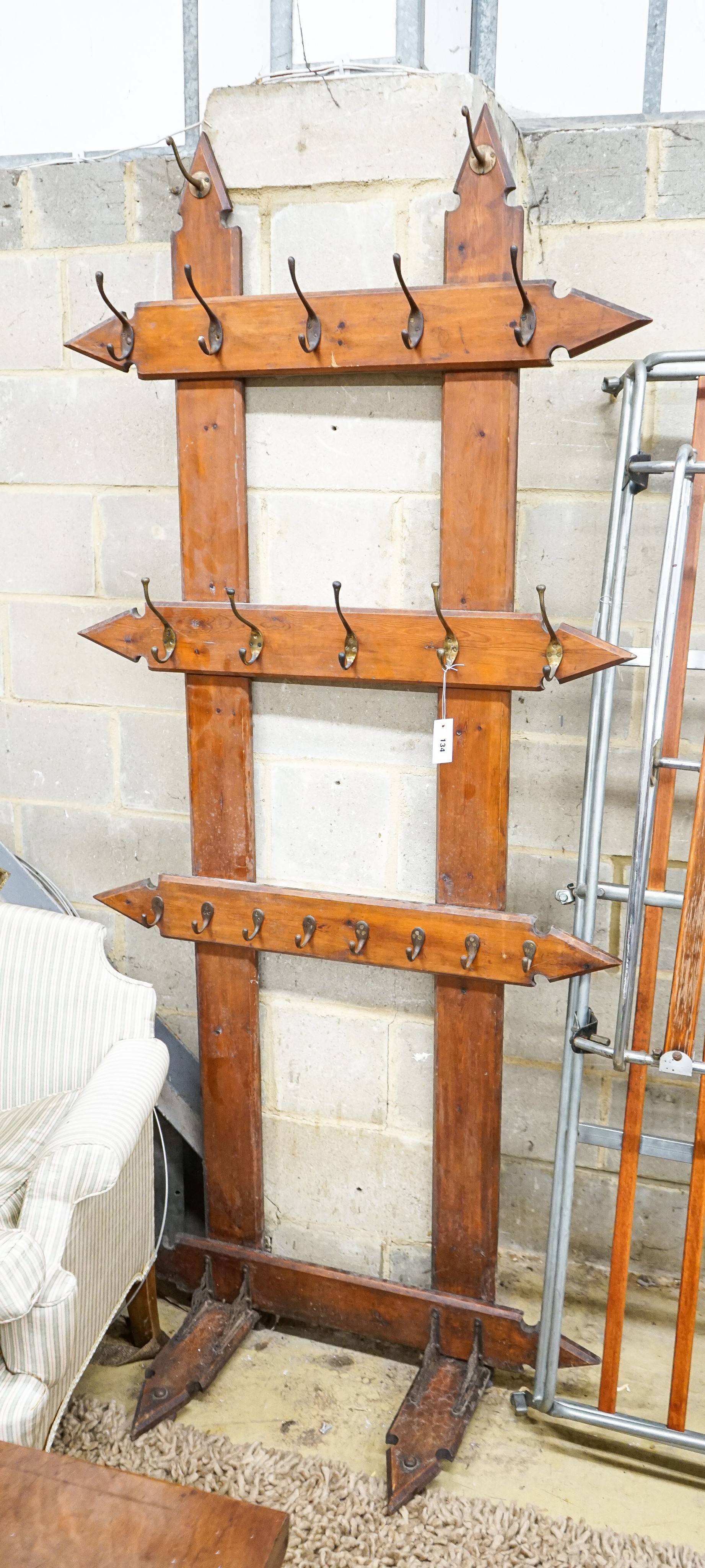 A late Victorian pitch pine hall stand, width 96cm, height 212cm                                                                                                                                                            