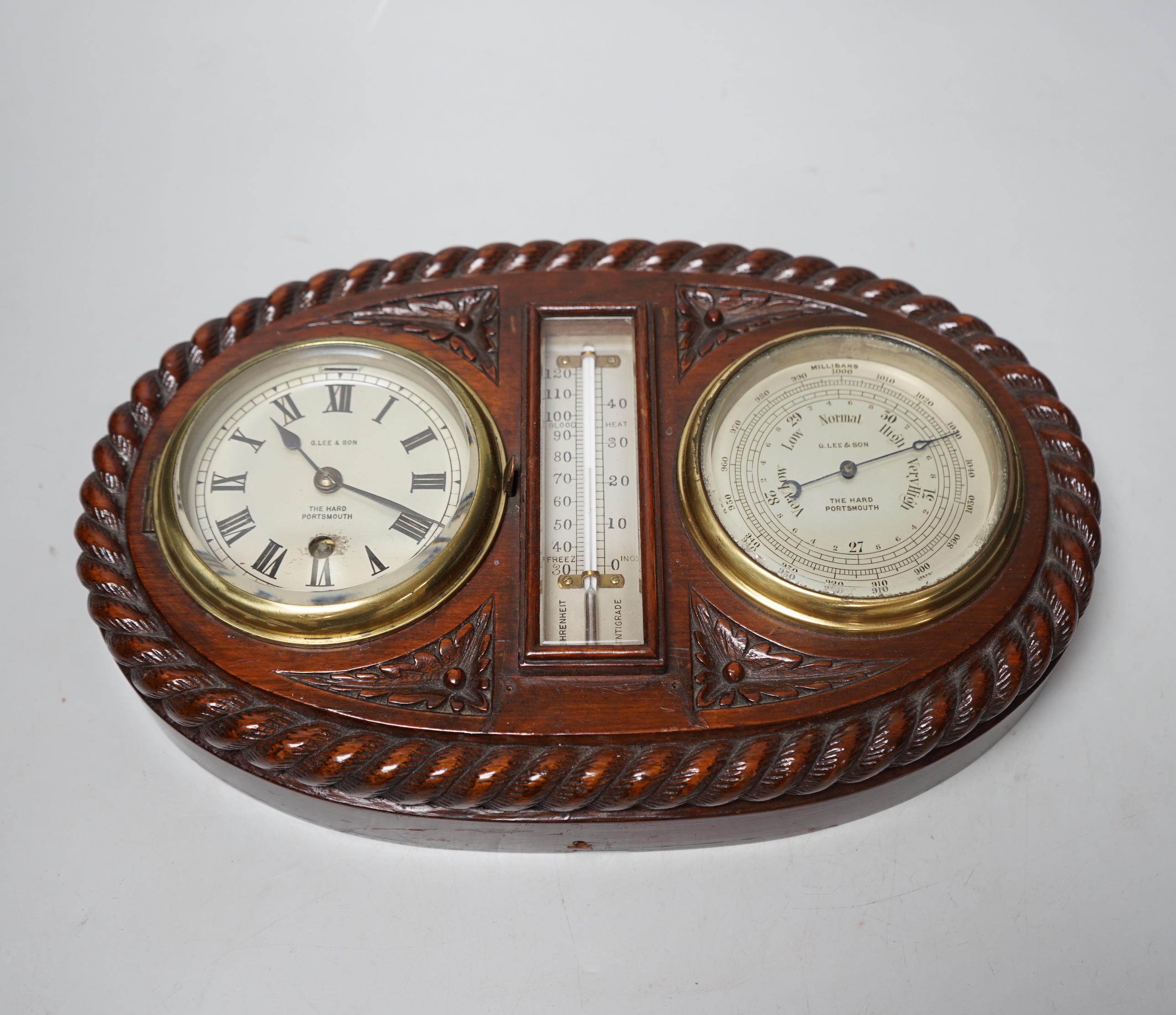 A G. Lee and son oak marine style clock barometer, 31.5cm wide                                                                                                                                                              