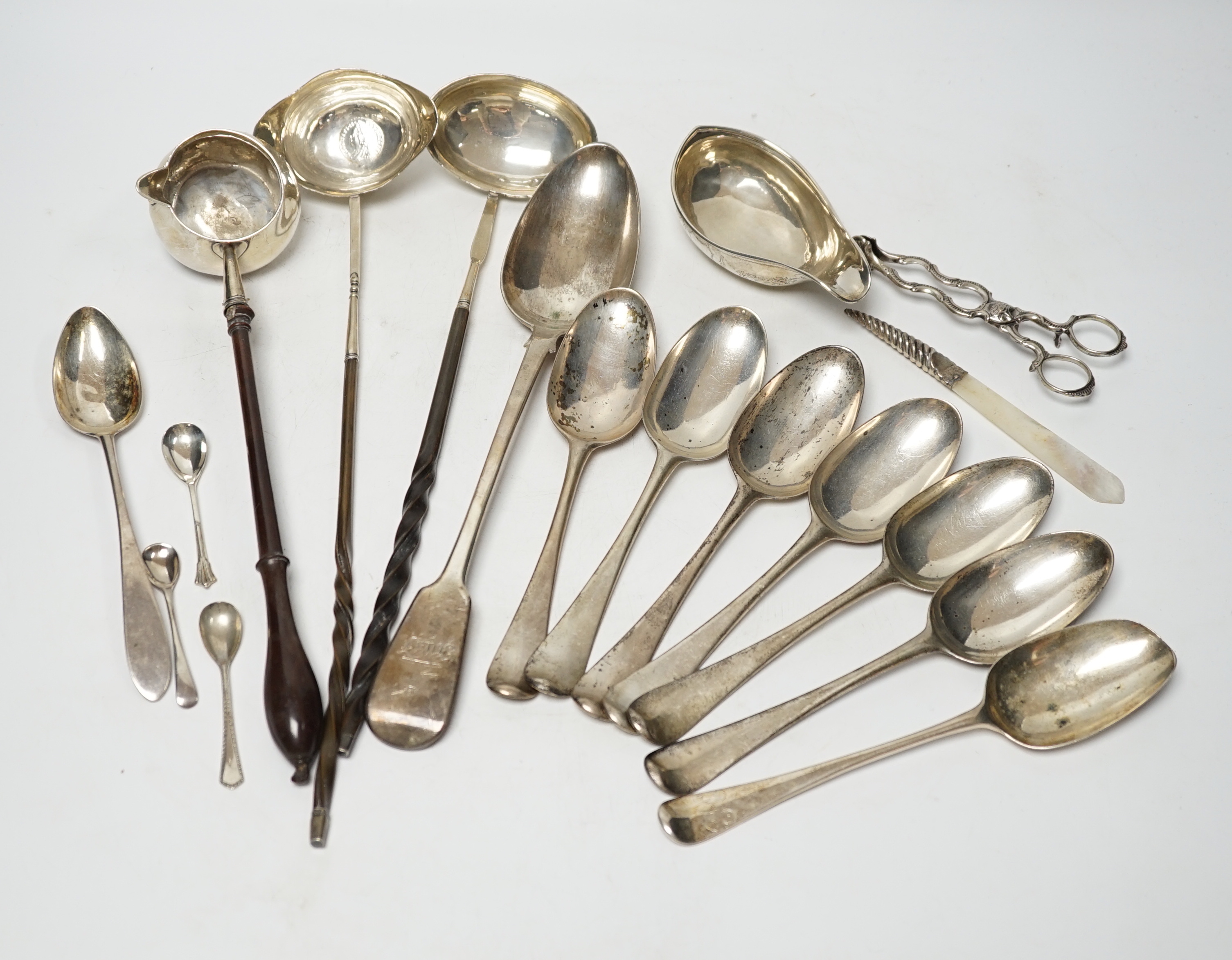 A late William IV silver fiddle pattern basting spoon, London, 1836, seven assorted 19th century silver base mark spoons, a Georgian Scottish dessert spoon, two toddy ladles, A George II brandy ladle, London, 1735, a Geo