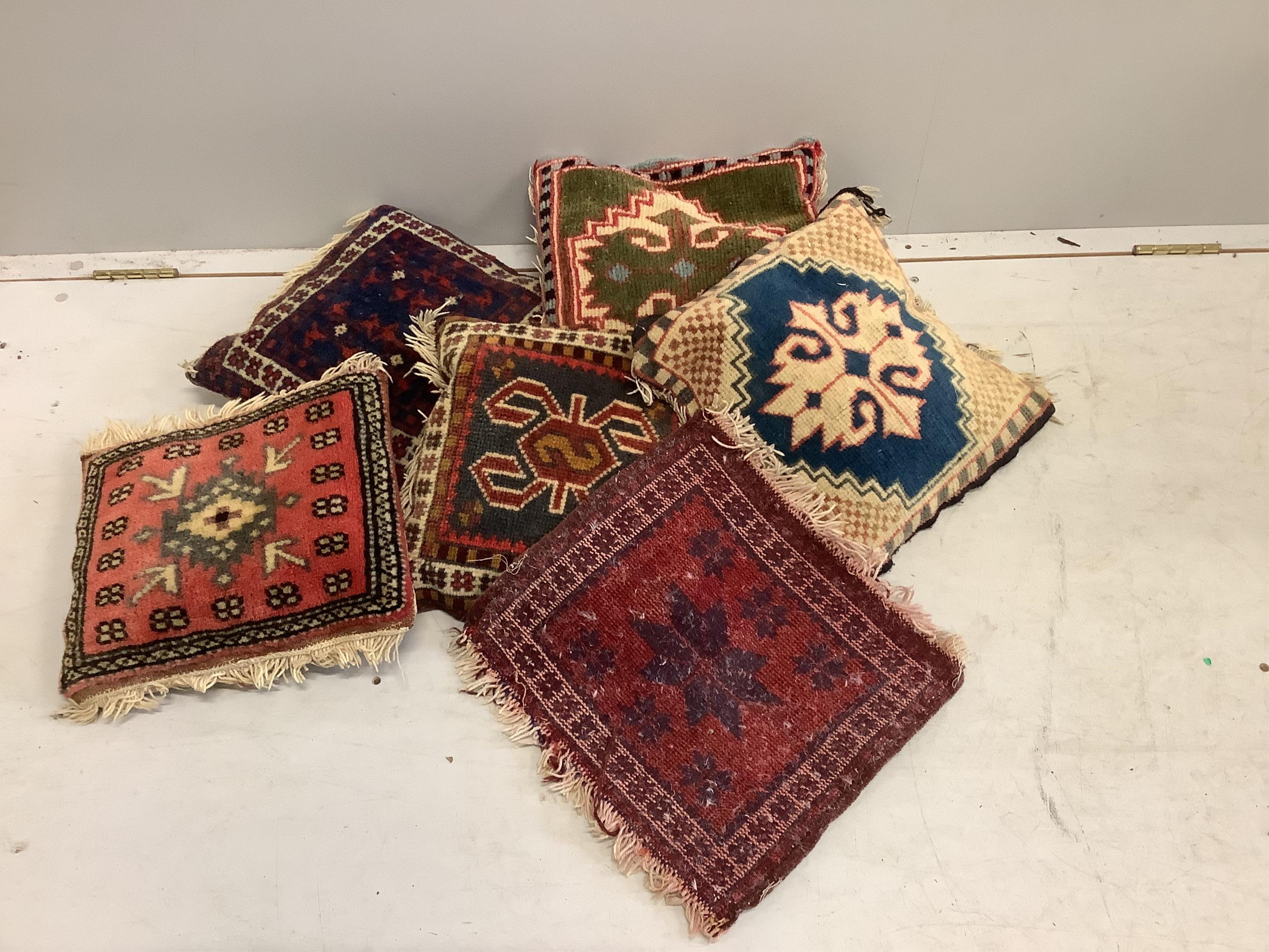 Six Turkish cushions/covers, largest 38 x 34cm. Condition - fair                                                                                                                                                            