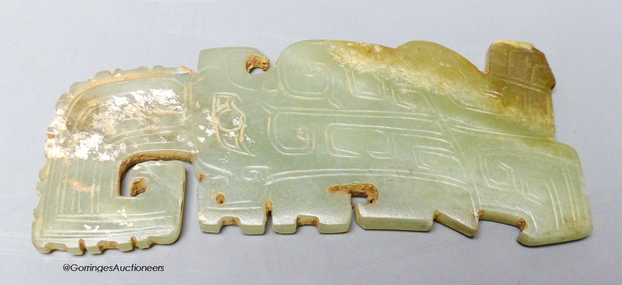 A Chinese archaistic green jade plaque, width 9cm                                                                                                                                                                           