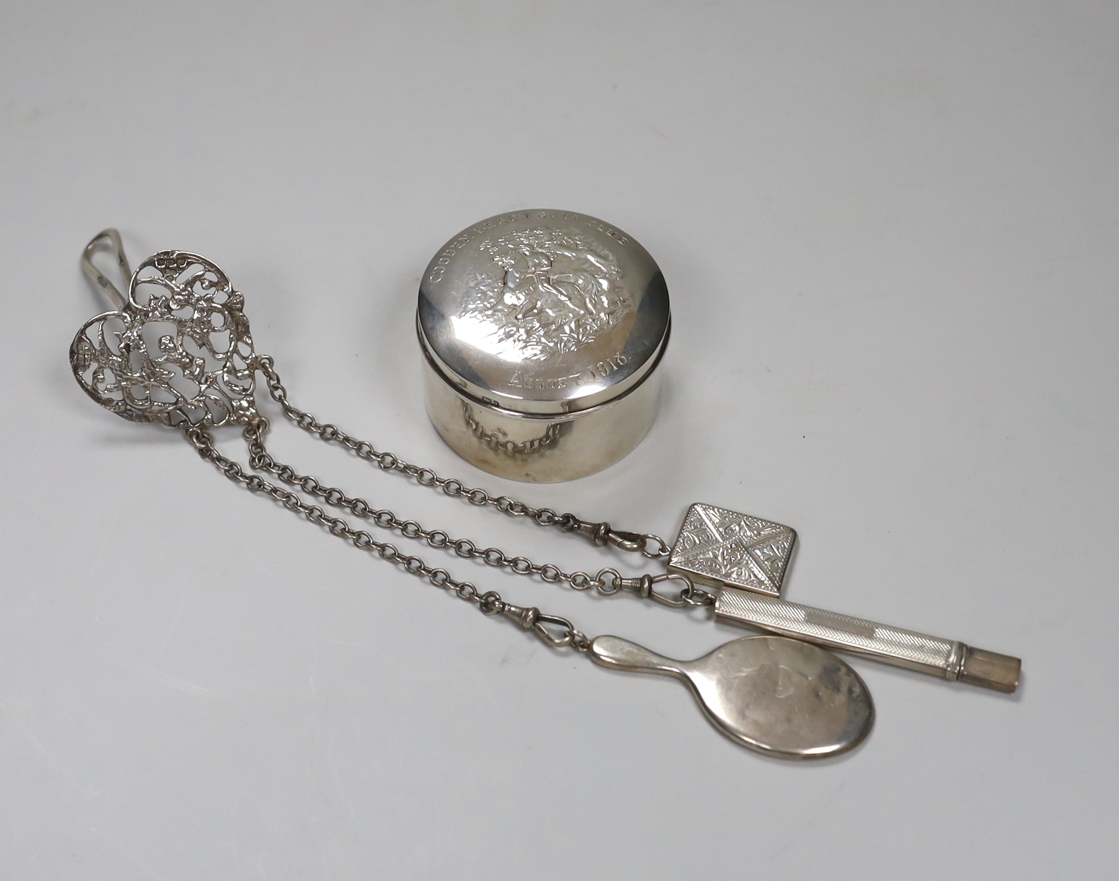 An Edwardian silver trinket jar, with Cooden Beach Golf Club 1918 inscription, 6.5cm, 71 grams and an Edwardian chatelaine, hung with a stamp face, pencil and miniature mirror, gross 50 grams                             