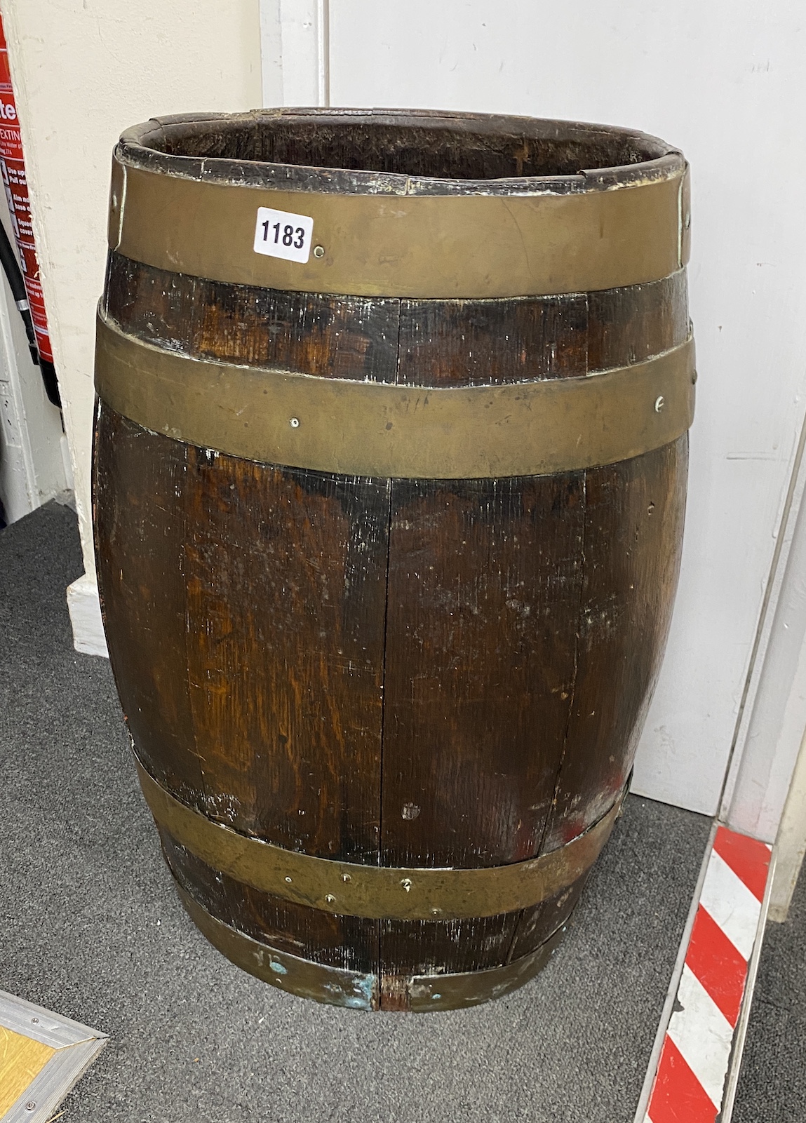 An oval oak staved and brass coopered barrel stick and umbrella stand, height 61cm                                                                                                                                          