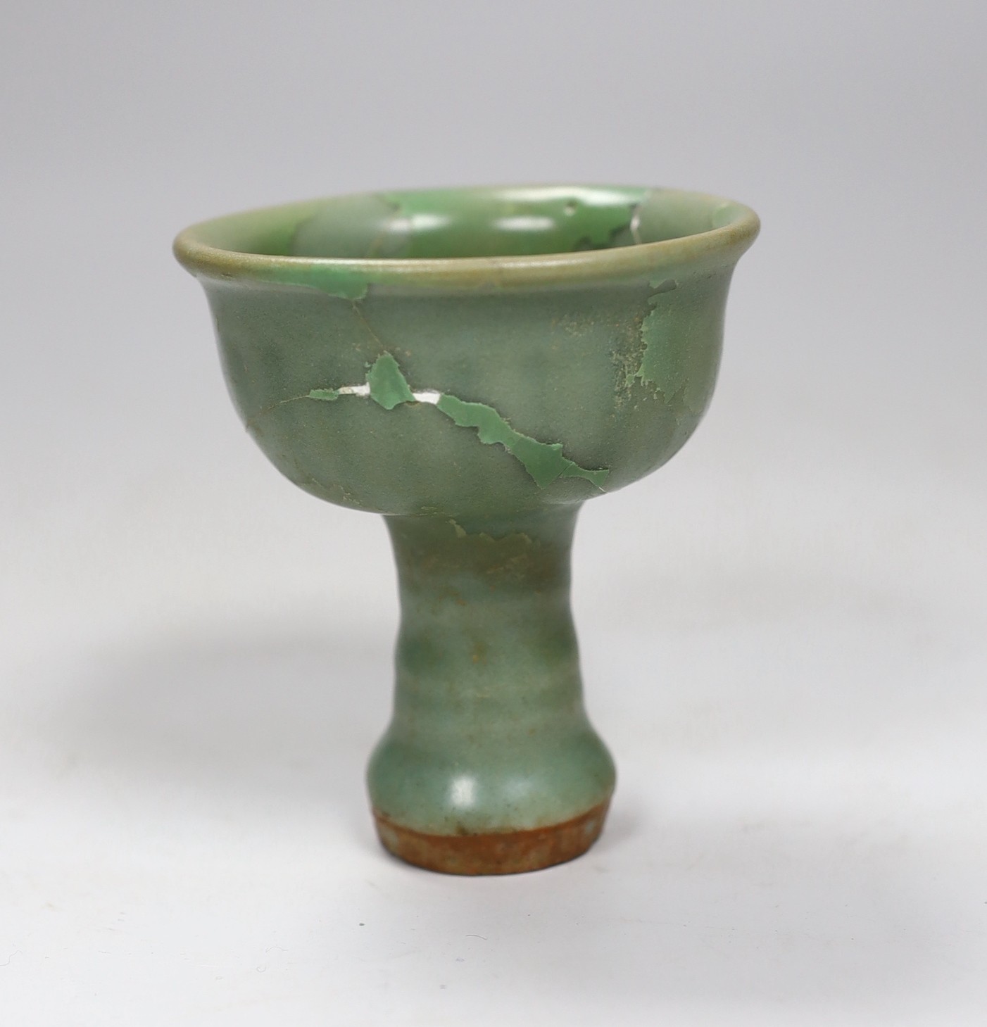A Chinese Longquan celadon stem cup, Ming dynasty, 10cm, restored                                                                                                                                                           