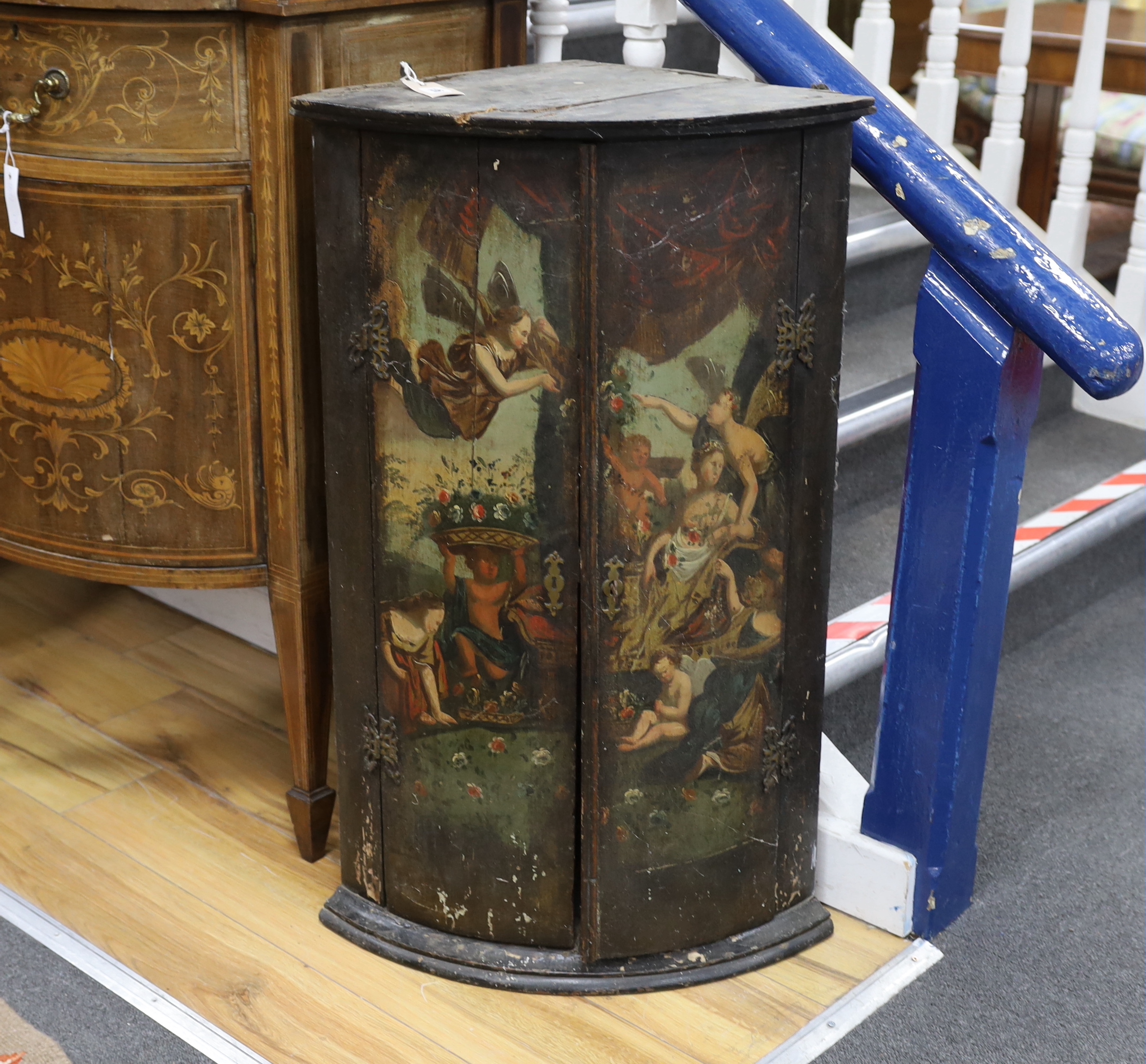 An 18th century painted bowfront hanging corner cupboard, width 56cm, depth 39cm, height 90cm                                                                                                                               