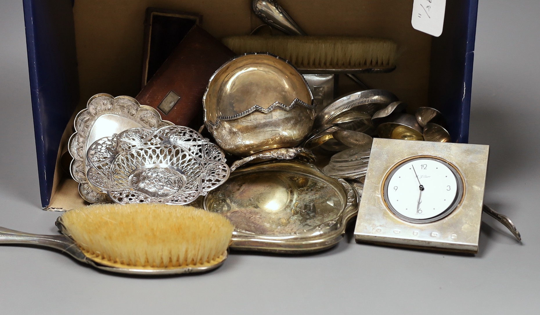 A group of assorted silver, white metal and plated wares including a pair of decanter labels, a cased Victorian knife, fork and spoon christening set, an engine turned cigarette box, a pair of white metal salts, three wh