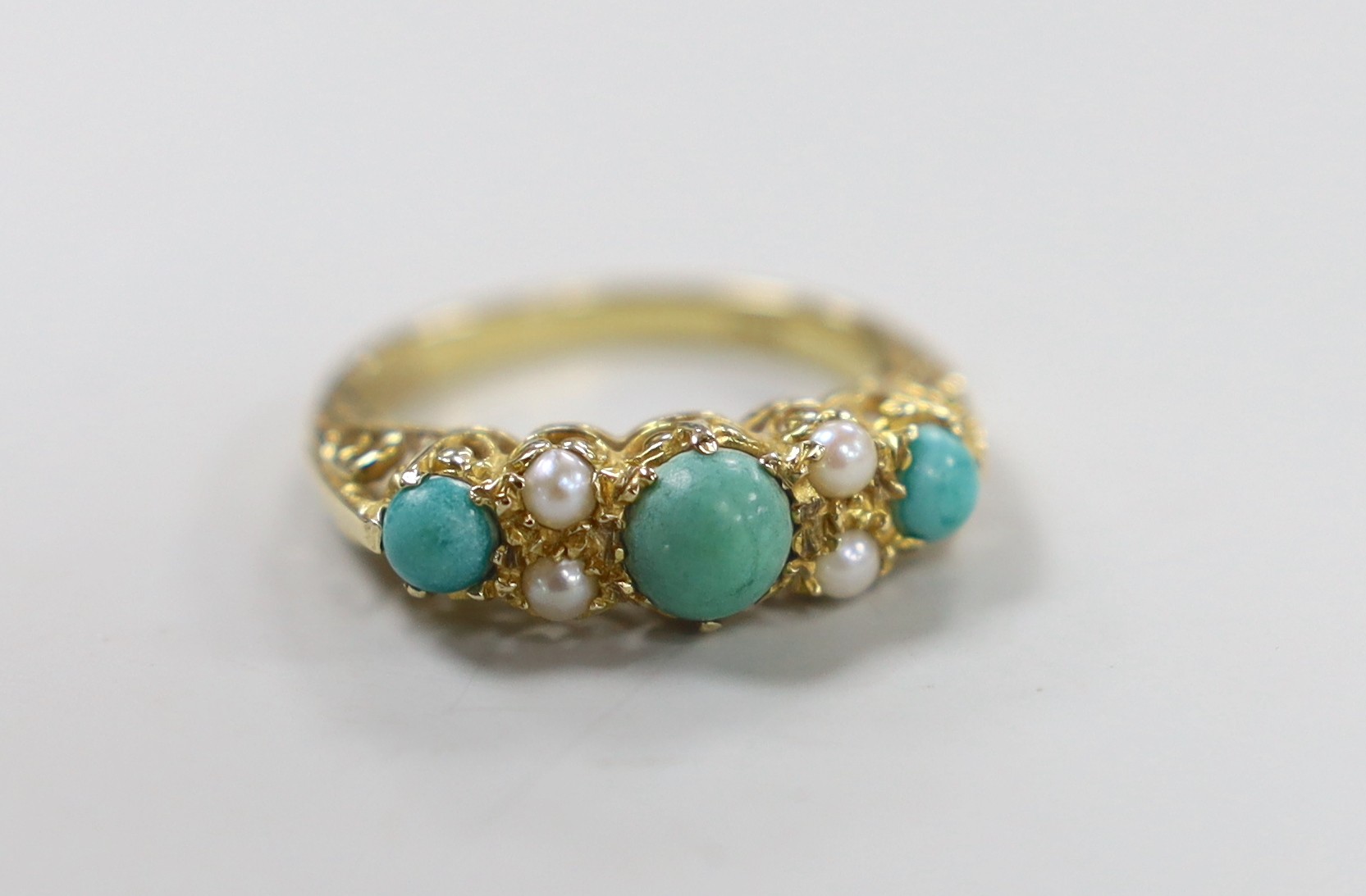 A 1960's 9ct gold, split pearl and turquoise ring set half hoop ring, size O, gross weight 3.4 grams.                                                                                                                       