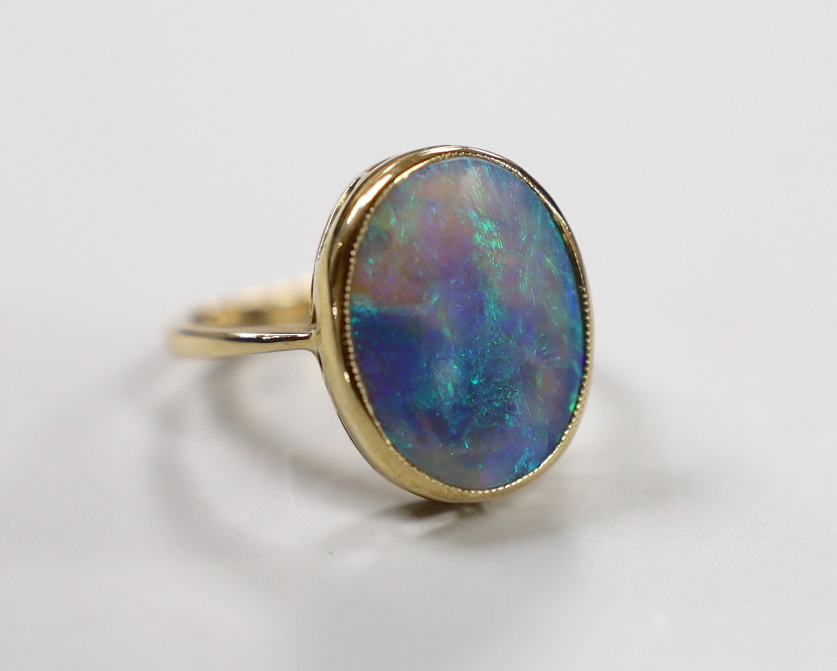 A 9ct and oval black opal set ring, size O, gross weight 4.3 grams.                                                                                                                                                         