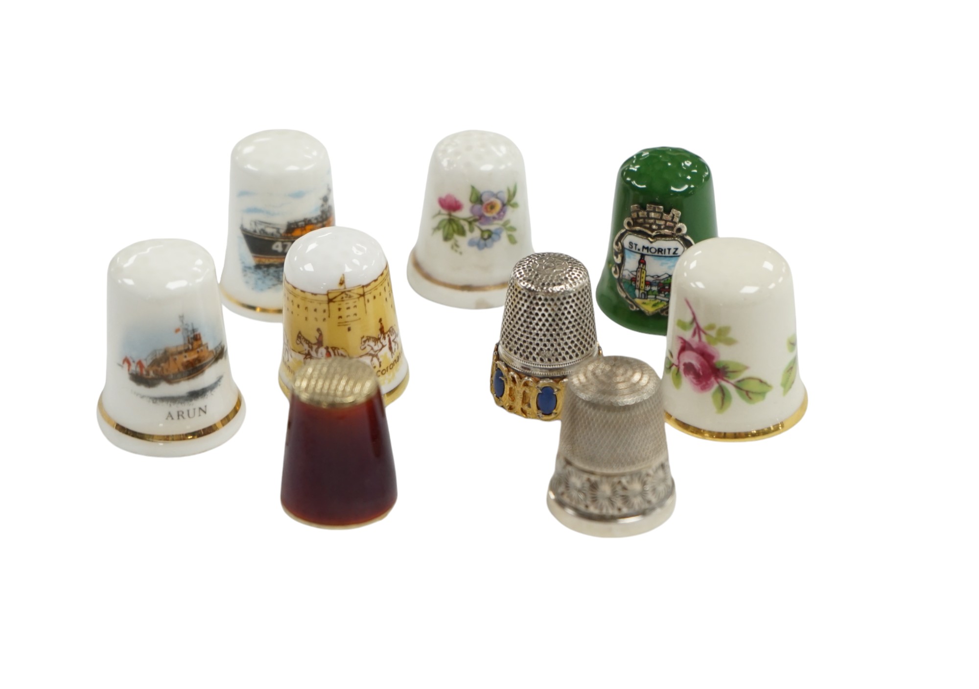 A large collection of silver, nickel, brass and ceramic thimbles, and two thimble display perspex domes. Condition - fair                                                                                                   