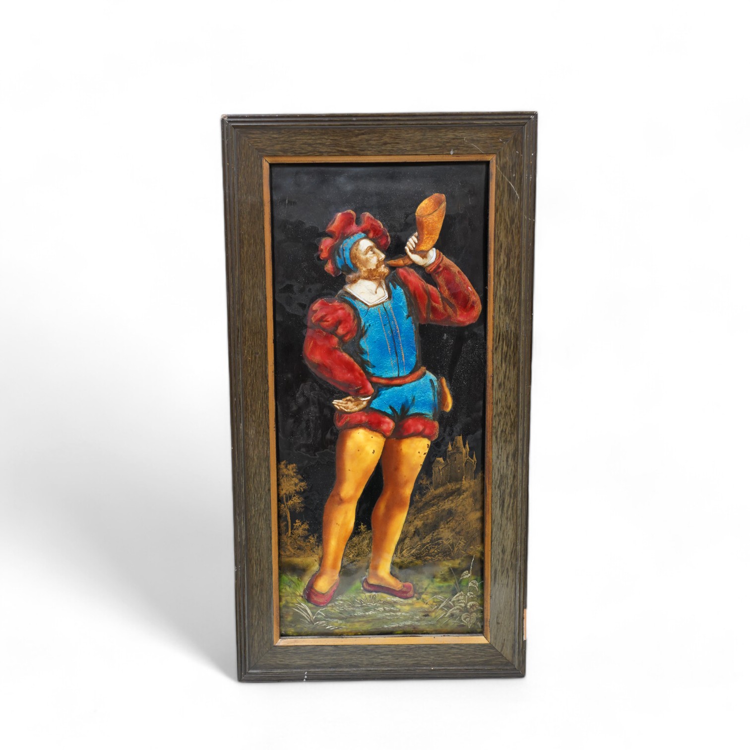 A framed Limoges enamel panel of a medieval piper, overall 47 x 25cm. Condition - good                                                                                                                                      