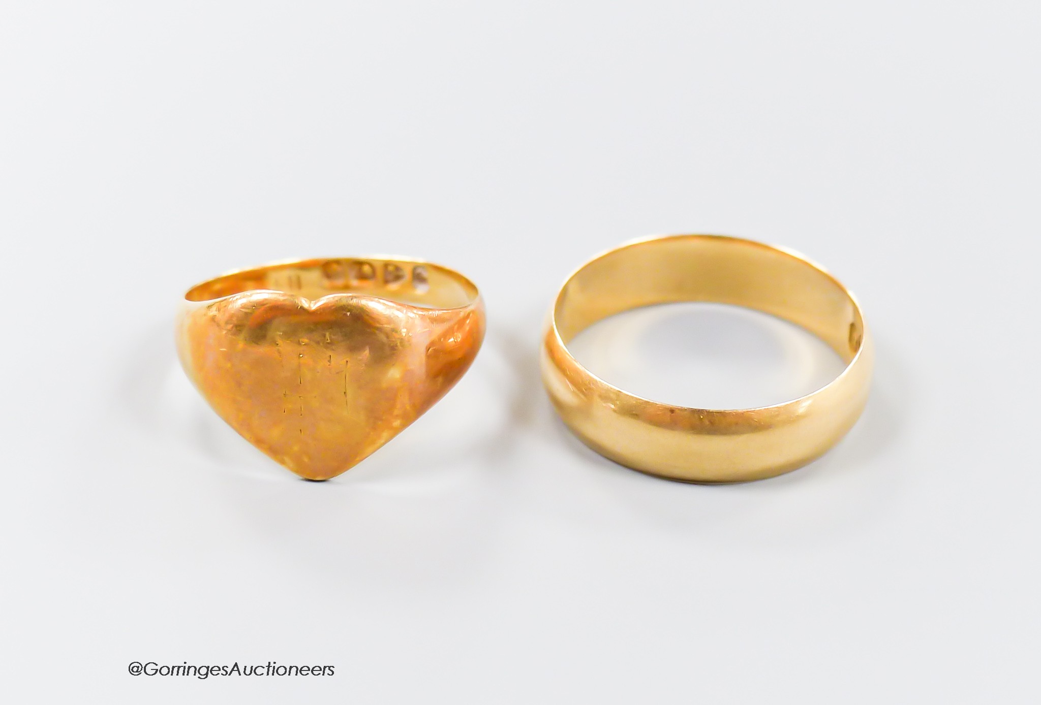 A late Victorian 18ct gold wedding band, size Q and a similar heart shaped signet ring, size M/N, gross 8.3 grams                                                                                                           