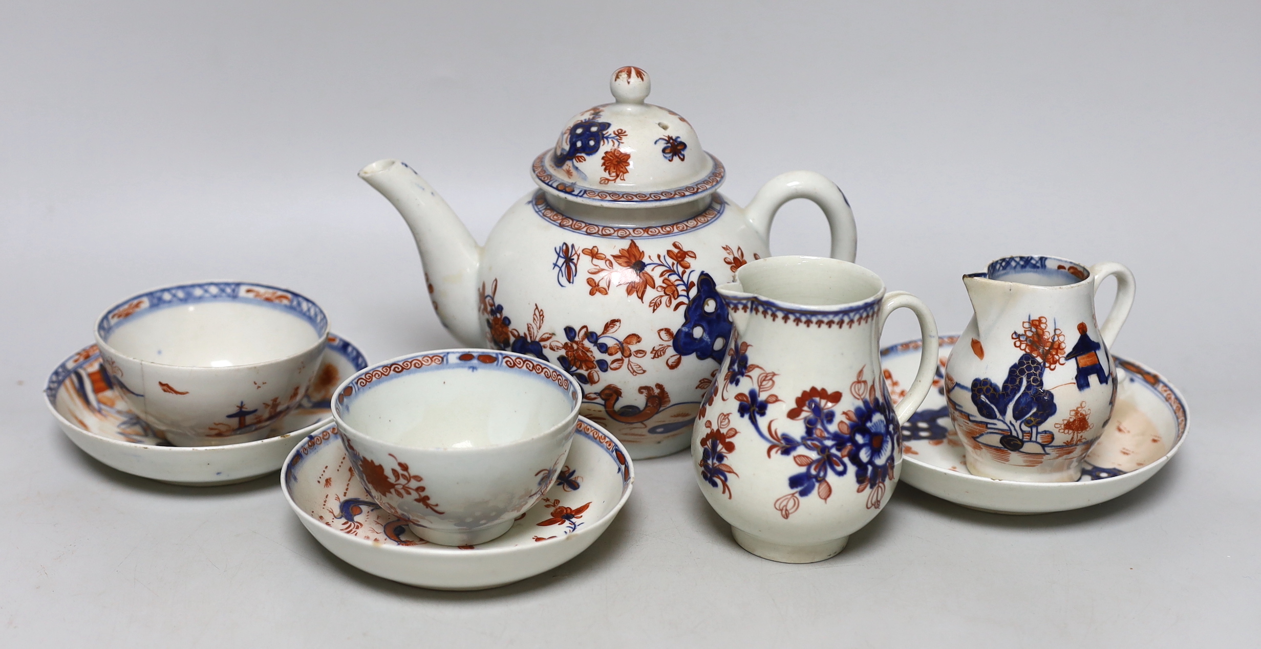 A group of Lowestoft Imari teawares, c.1770, including a Redgrave two bird pattern teapot and cover, tea bowl and two saucers, a Dolls House pattern sparrow beak cream jug and teabowl with saucer and a further sparrow be