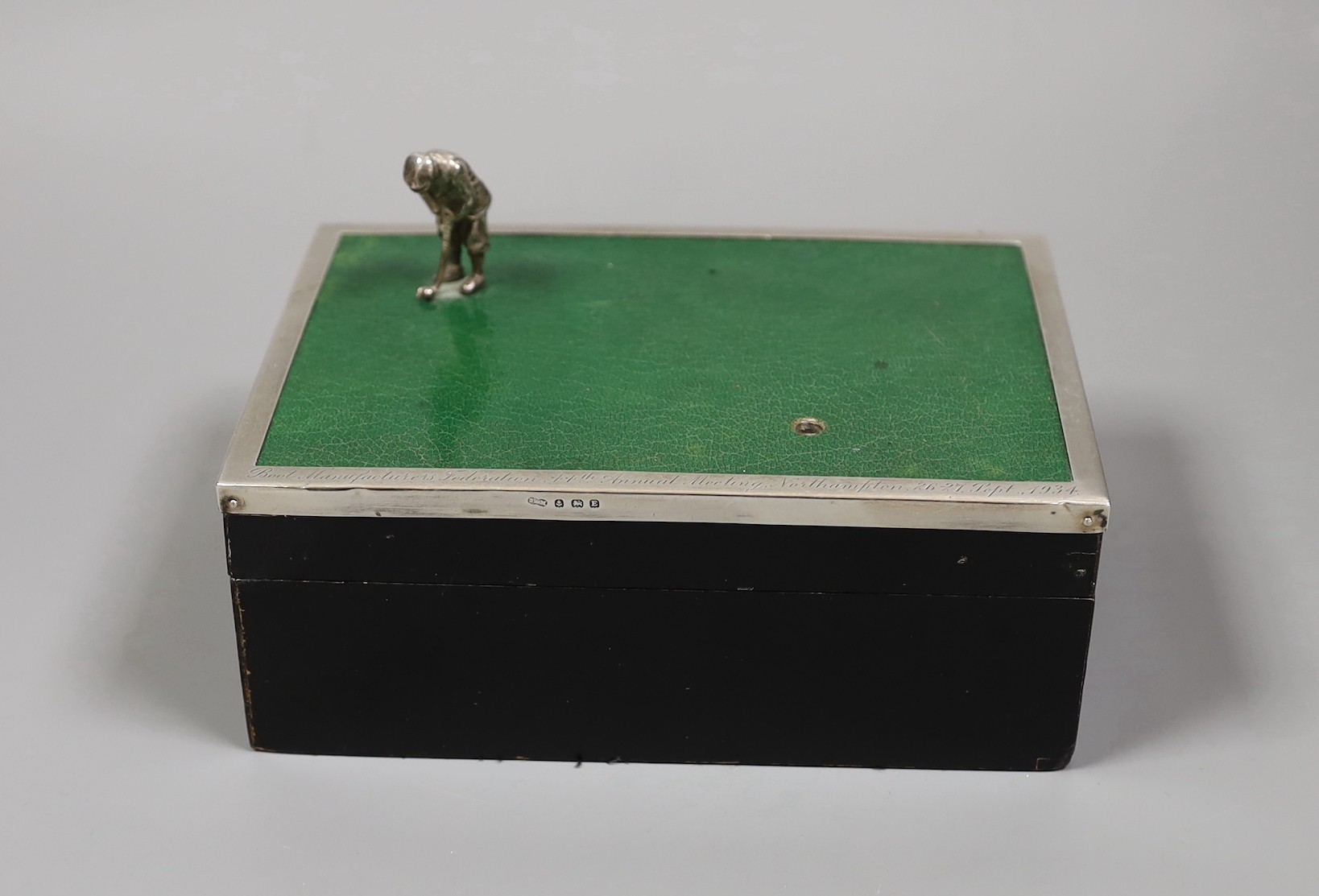 A George V silver and leather mounted golf related card box, with engraved inscription dated 1934, Sanders & MacKenzie, Birmingham, 1930, 17.2cm.                                                                           