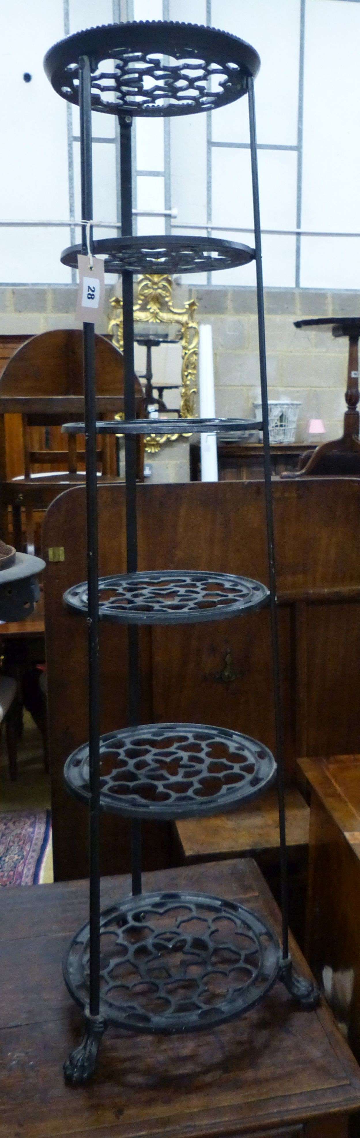 A Victorian style cast metal six tier pot stand, H.126cm                                                                                                                                                                    