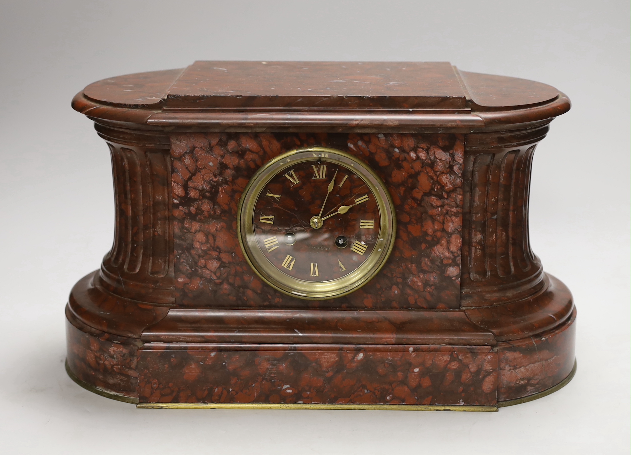 A French rouge marble eight day mantel clock, 38cm wide                                                                                                                                                                     