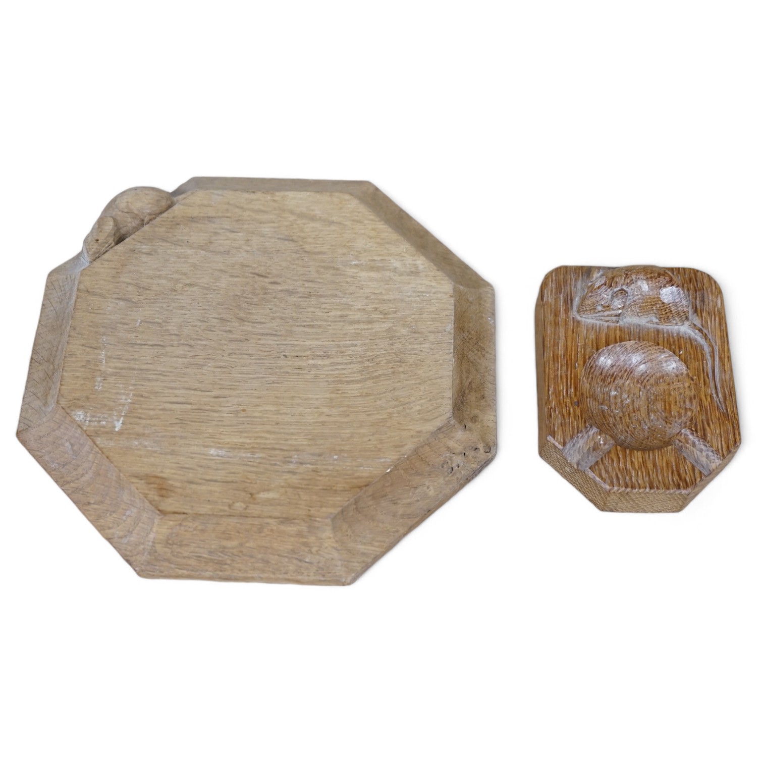 A small carved wooden Mouseman cheese board together with a Mouseman ashtray, largest 19cm wide. Condition - fair to good                                                                                                   