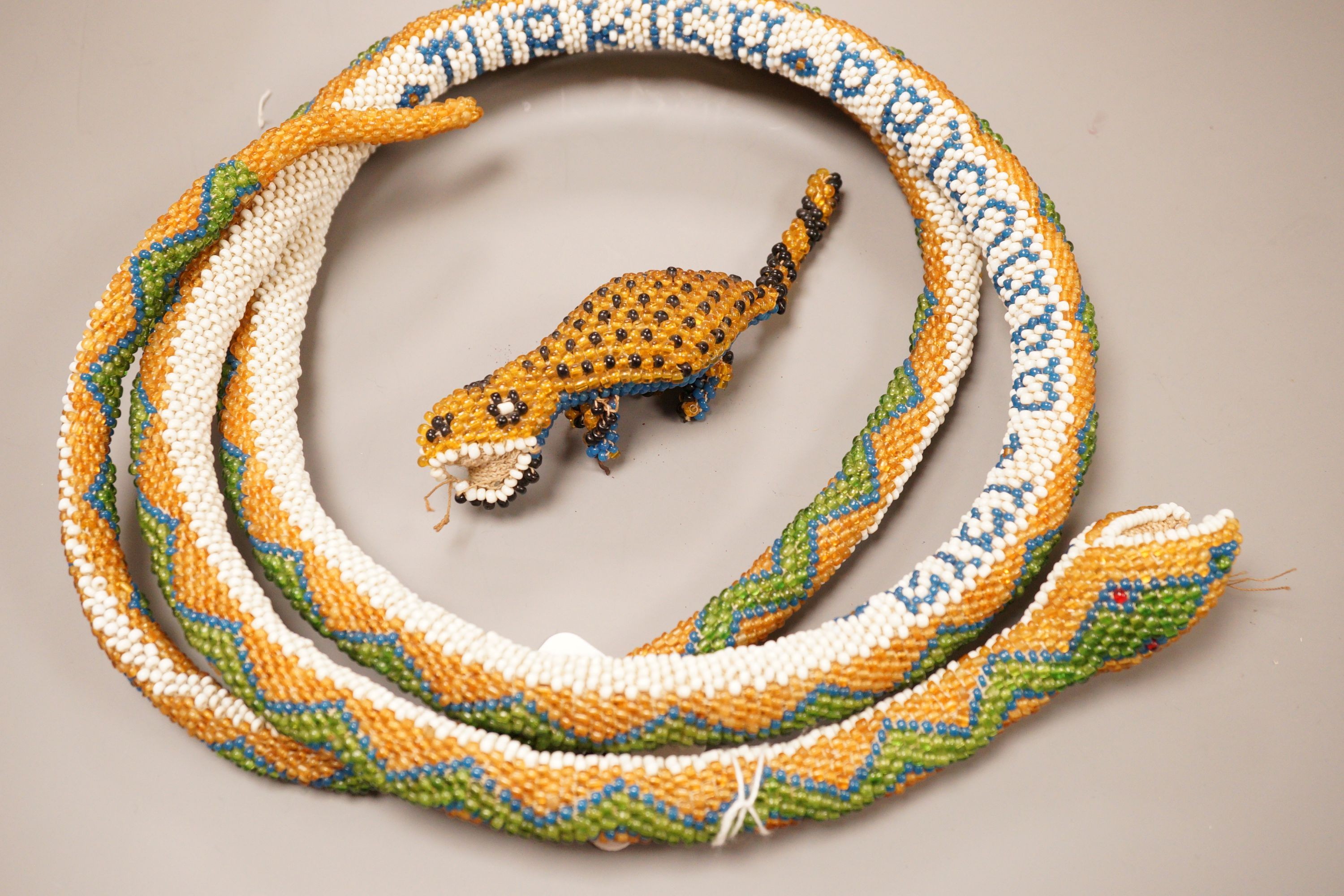 A Turkish Prisoner beadwork model of a snake, and another model                                                                                                                                                             