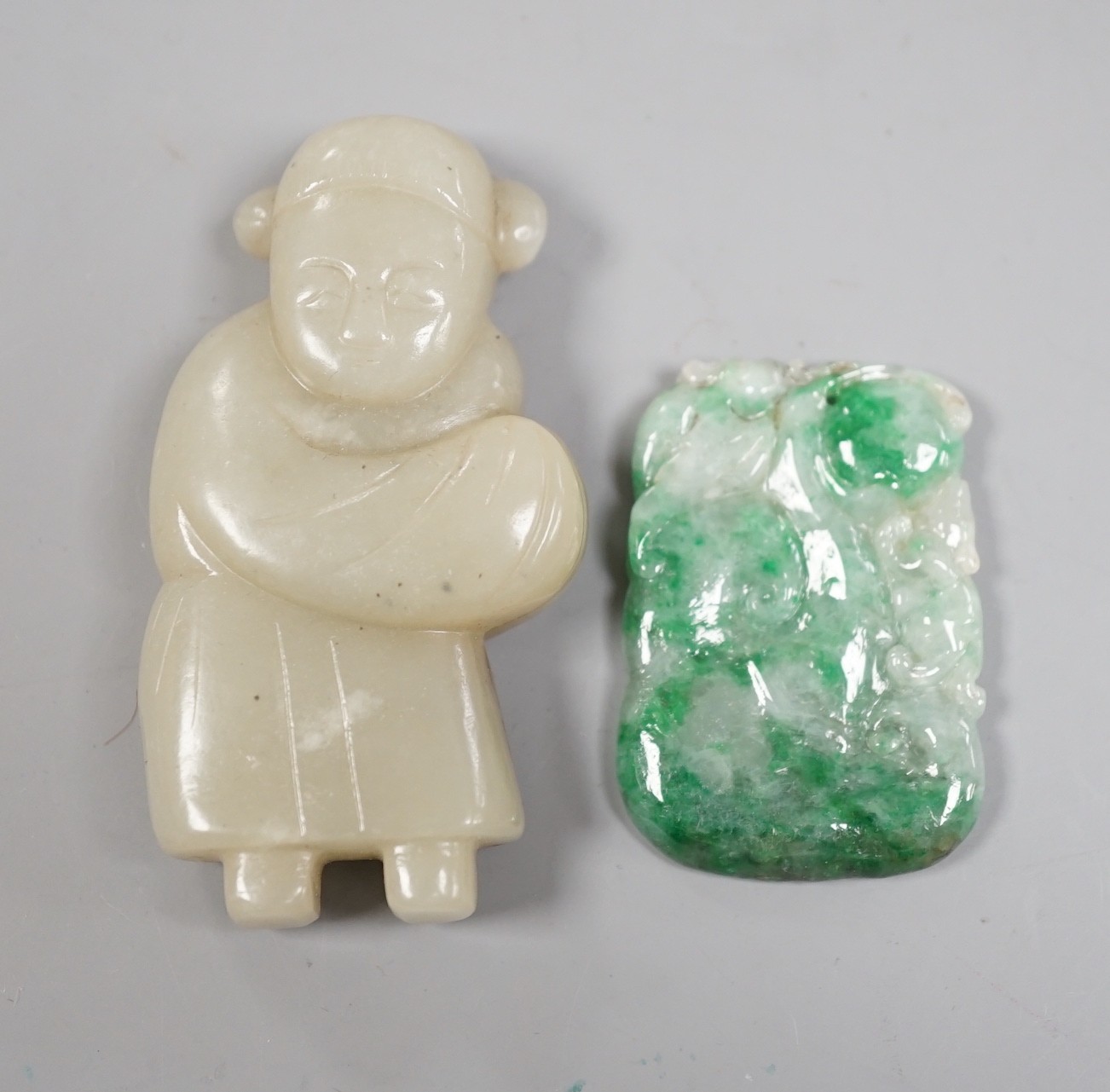 A Chinese celadon jade figure and a jadeite plaque (2)                                                                                                                                                                      