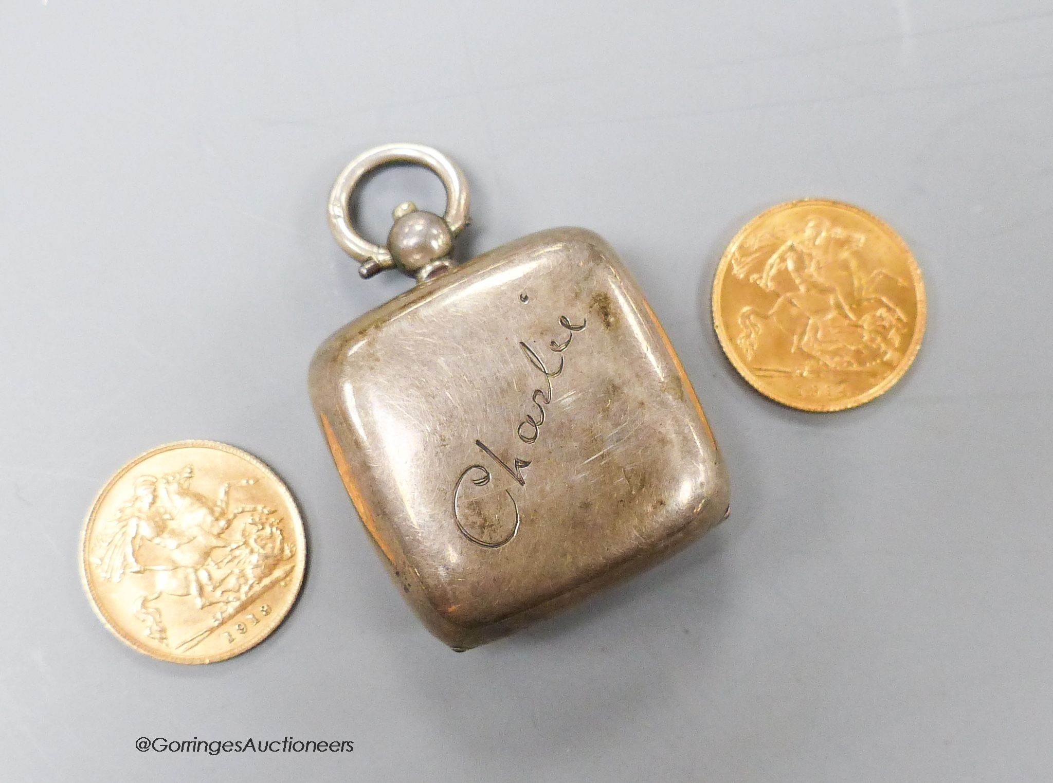 Two George V gold half sovereigns, 1913 & 1914 and an Edwardian silver sovereign case.                                                                                                                                      