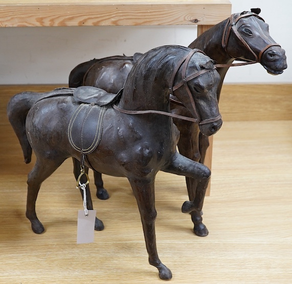 A pair of leather covered models of horses possibly Omersea for Liberty, 49cm. Condition - fair                                                                                                                             