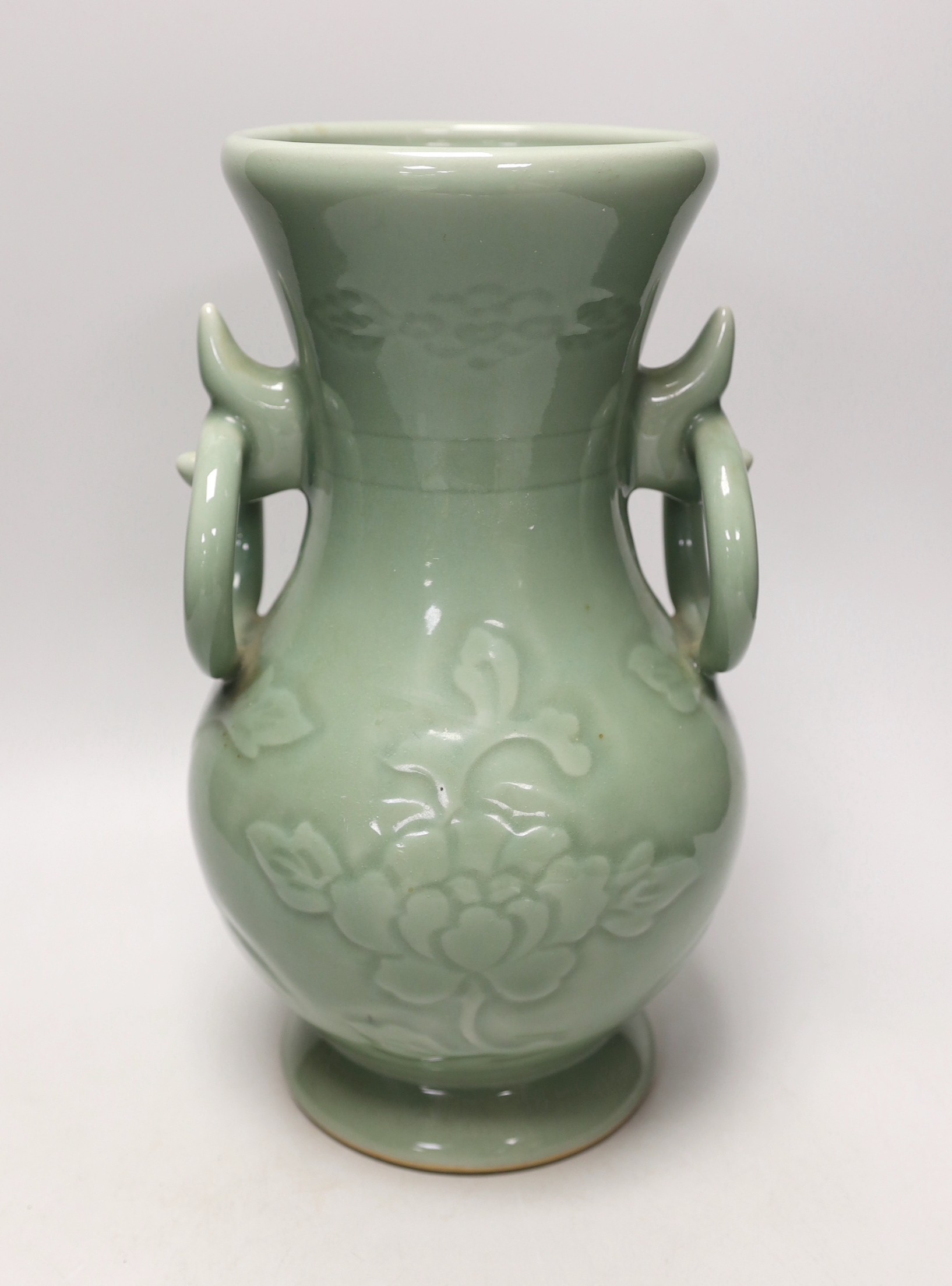 A two handled Chinese celadon glazed vase. 32cm tall                                                                                                                                                                        