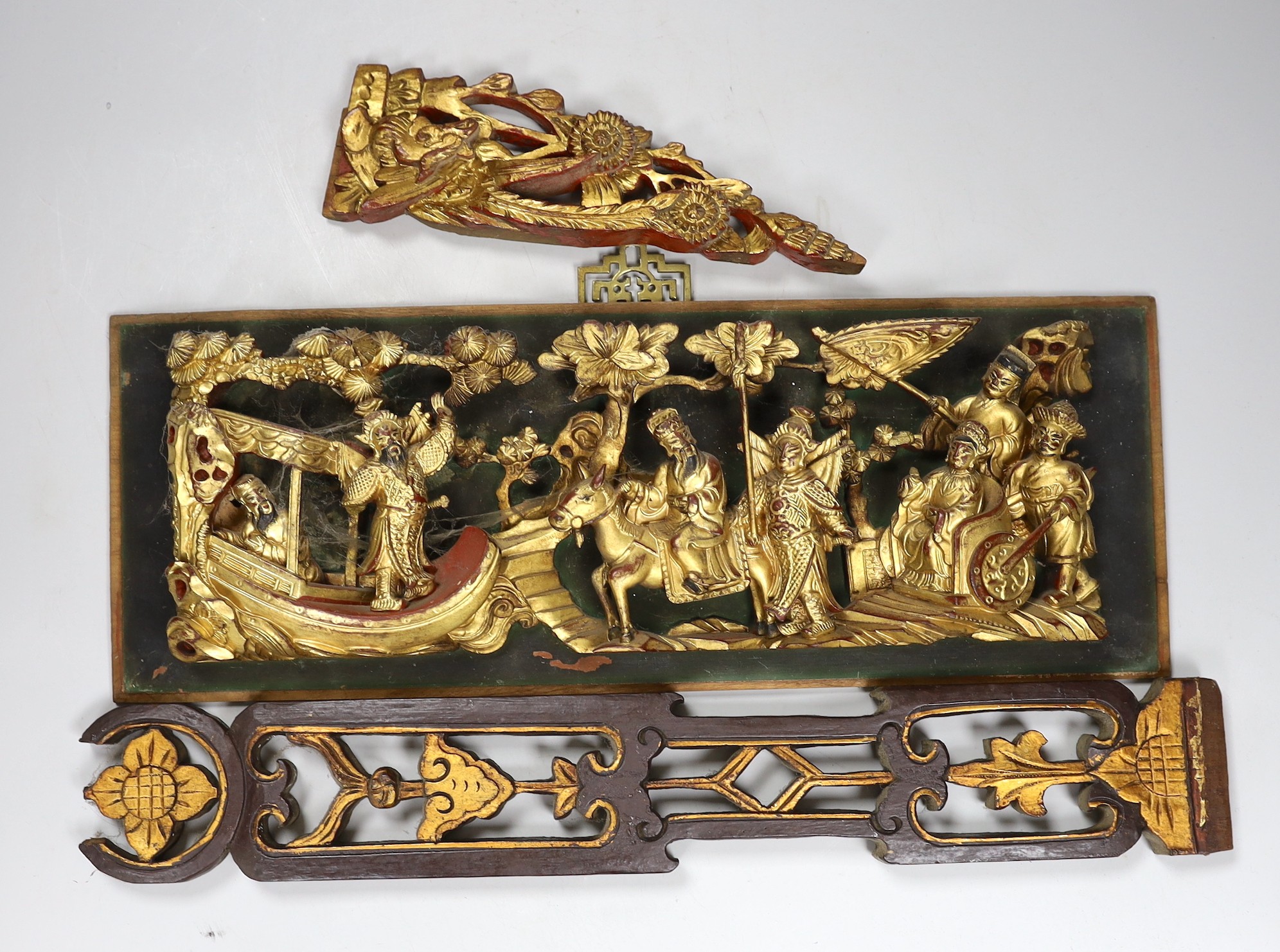 A carved gilt Chinese figural relief and two other similar items, relief 46cms wide, 17cms high                                                                                                                             