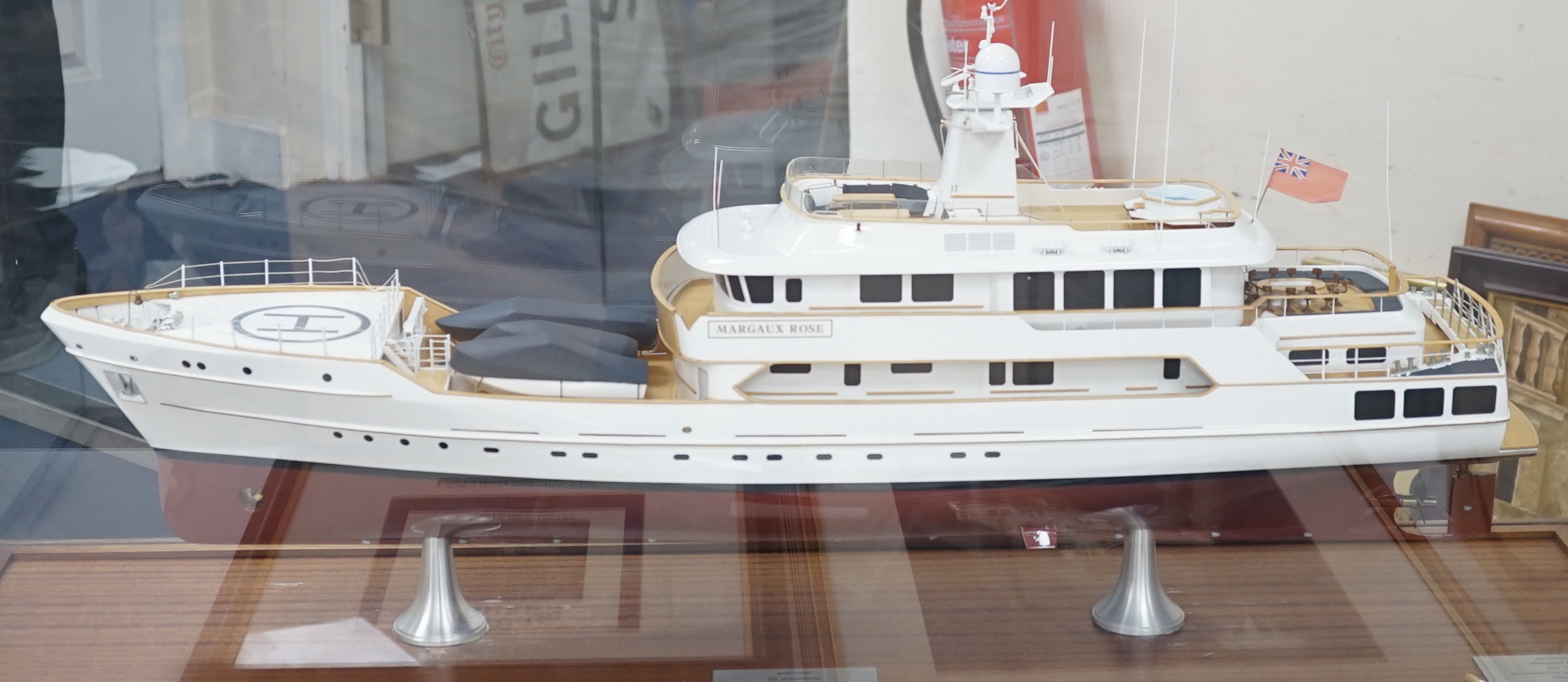 A model under glass of the Margaux Rose charter yacht (possibly owned by Sir Alan Sugard, together with two Michian Marine colour prints of the yacht, case 110cm wide                                                      