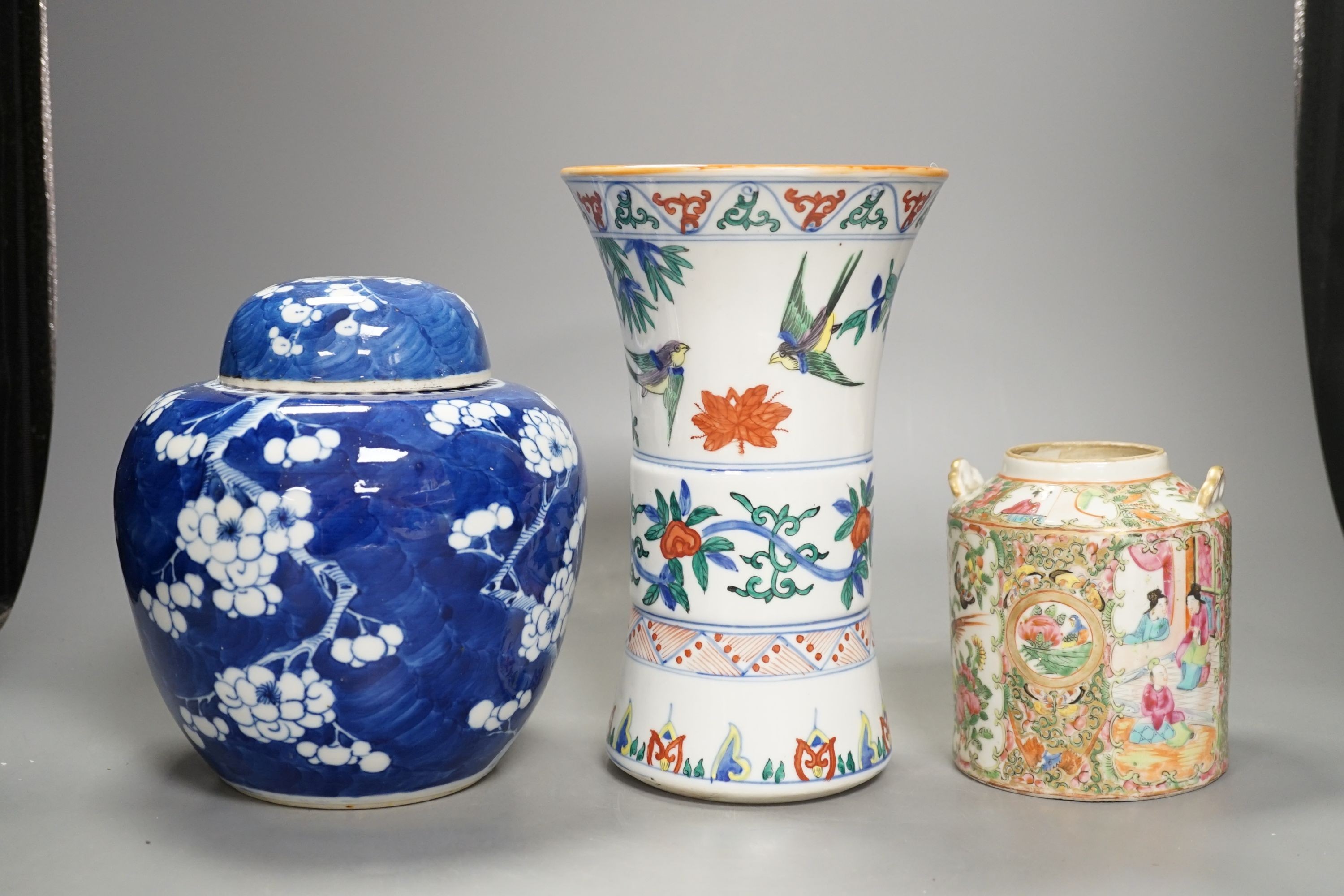 A Chinese prunus jar and cover, a polychrome vase and a famille rose jar, 24cms high.                                                                                                                                       