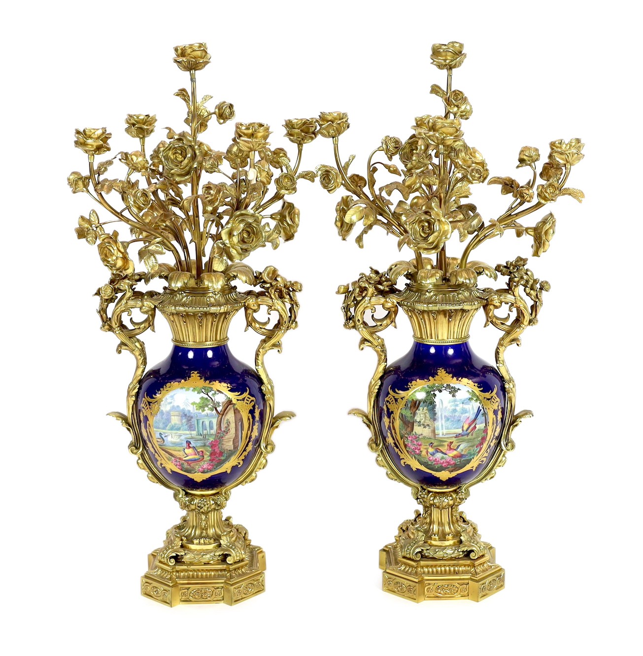 A pair of large French Sevres style ormolu mounted candelabra, in Louis XVI style, 19th century, 69cm high                                                                                                                  