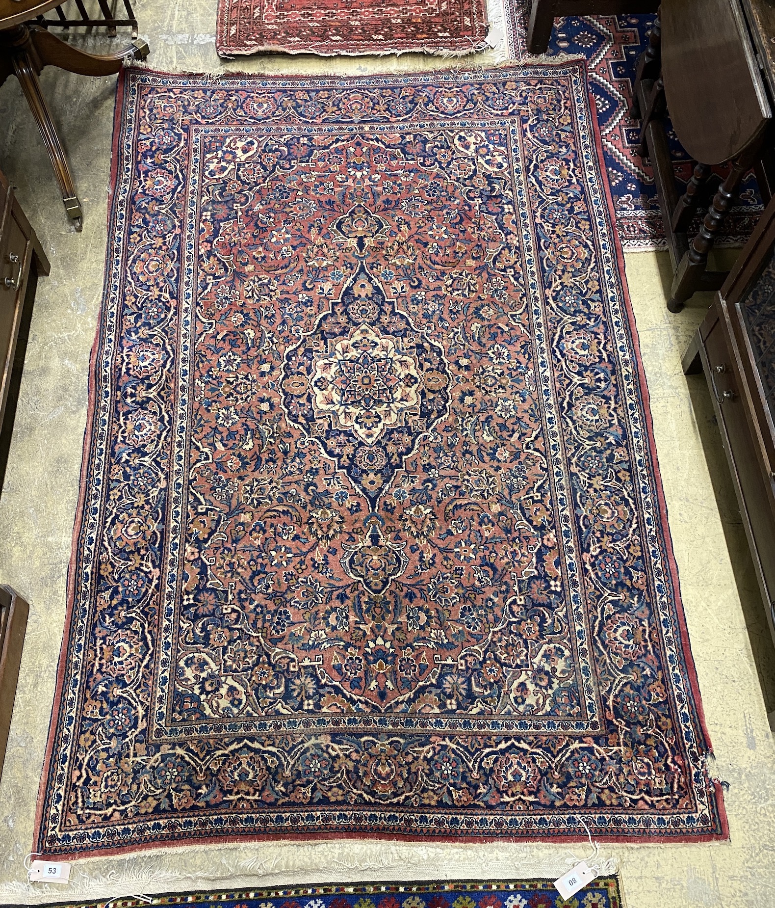 An Isphahan red ground rug, 206 x 133cm together with a Bokhara red ground runner                                                                                                                                           
