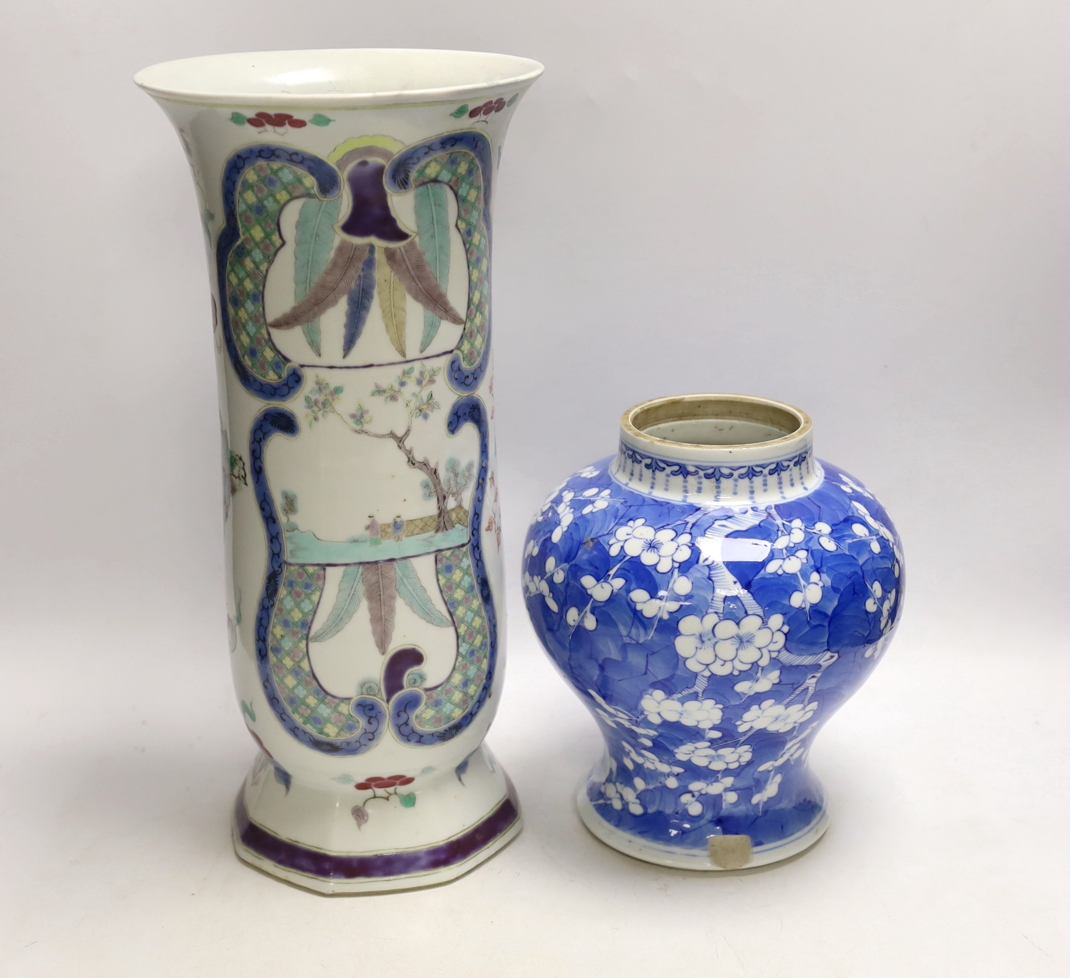 A Chinese enamelled felangcai porcelain beaker vase, 19th century and a 19th century Chinese blue and white Prunus vase, jar, 21cm high                                                                                     