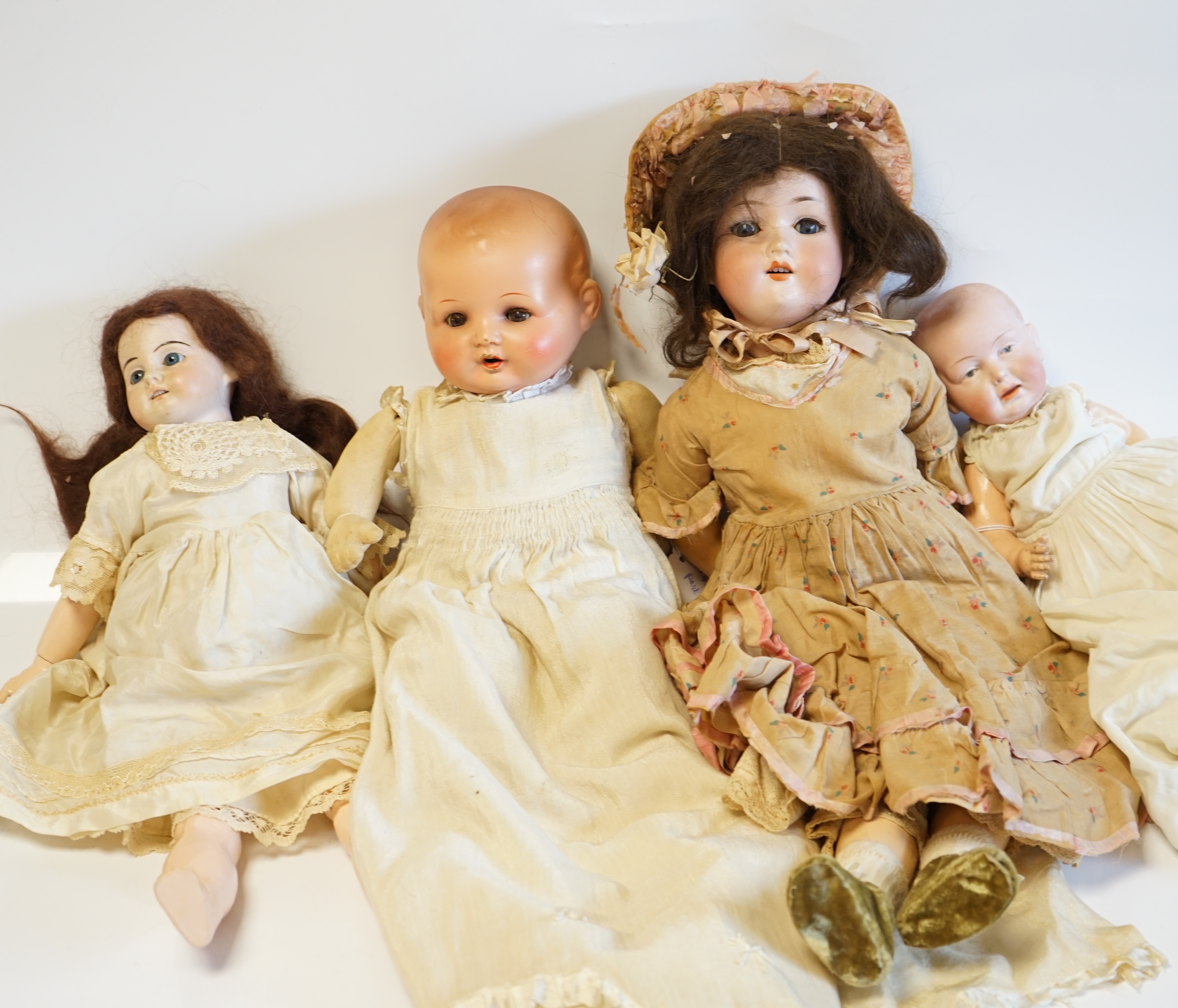 An AM390 doll, 47cm high, an Einco baby doll, 25cm, and a composition baby A.M. soft body modern jointed doll (4). Condition - fair                                                                                         