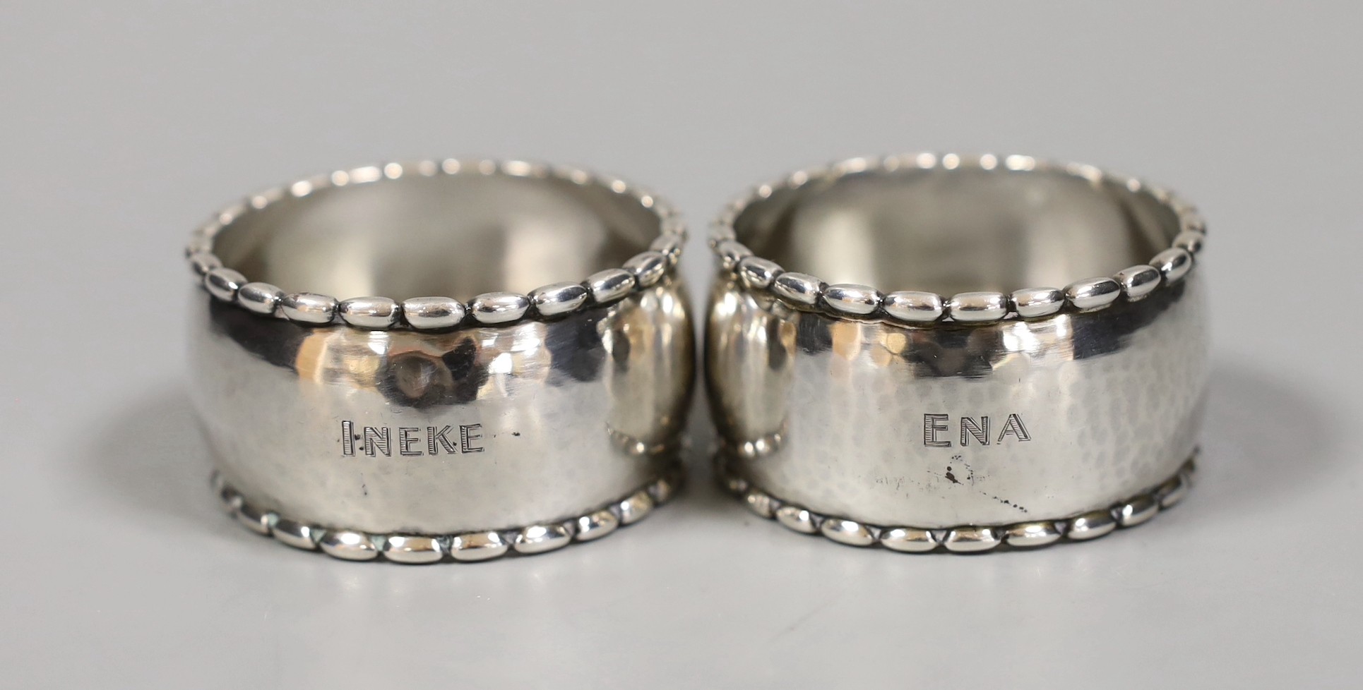 A pair of Georg Jensen sterling napkin rings, numbered 30D, 54mm.                                                                                                                                                           