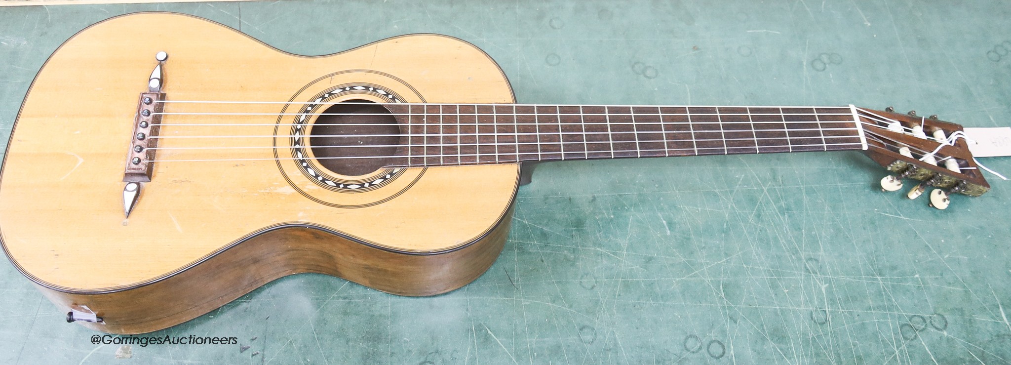 A Victorian parlour guitar, tuning pegs stamped by J. Gerard, 50 King Street, London                                                                                                                                        