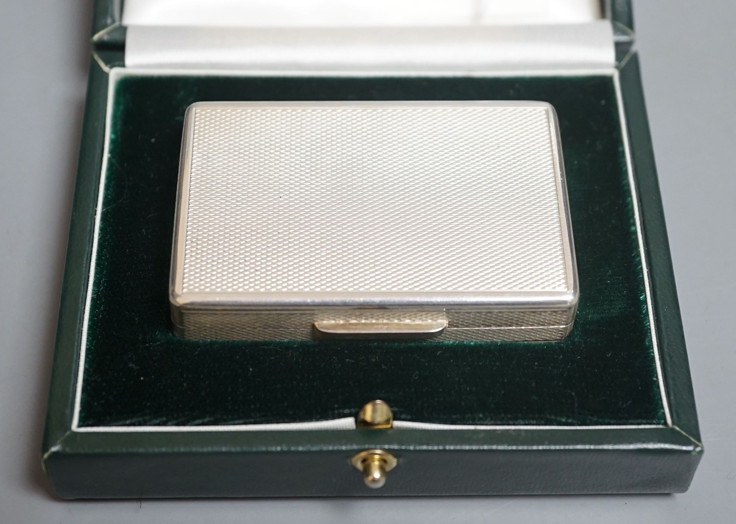 A modern cased engine turned silver rectangular pill box, by Peter John Doherty, London, 2007, 64mm, engraved 'Gallagher' on the base, in a Richard Jarvis of Pall Mall box.                                                
